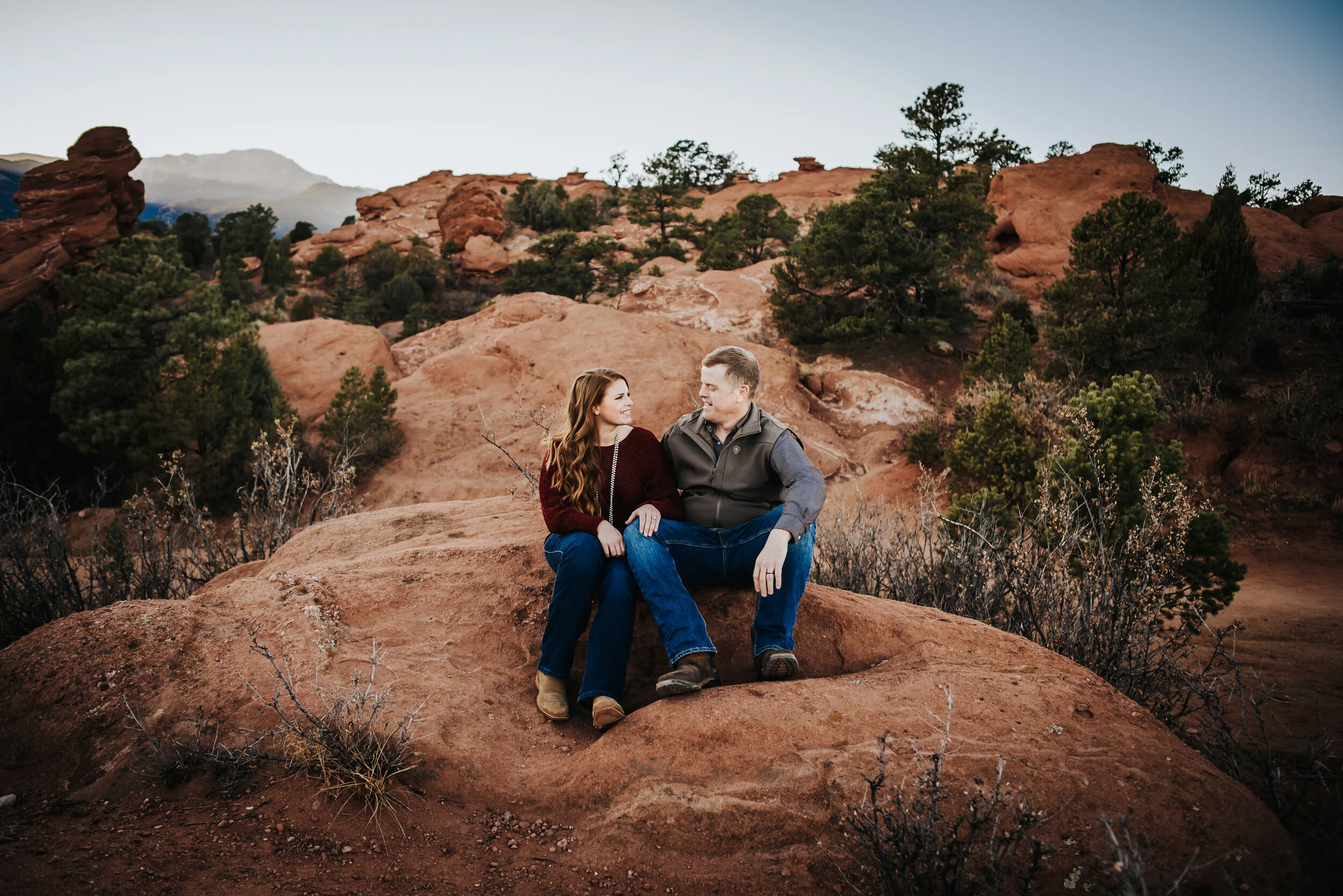 Couple in warm sunset light during couples session.
