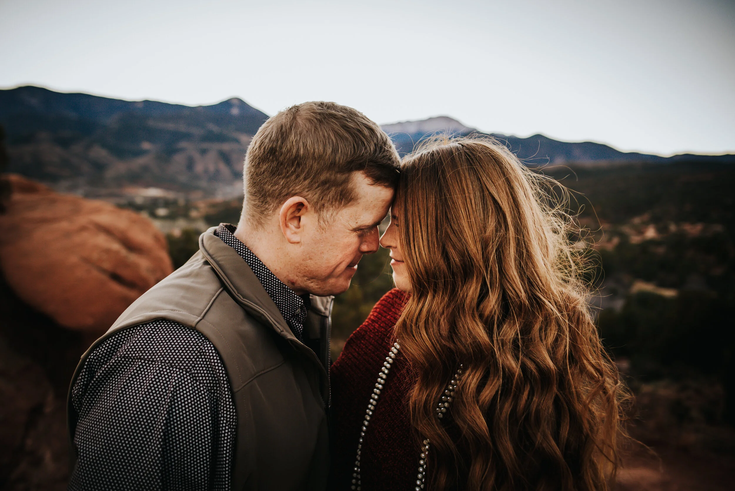 Quiet moment between couple with red rocks in the background.