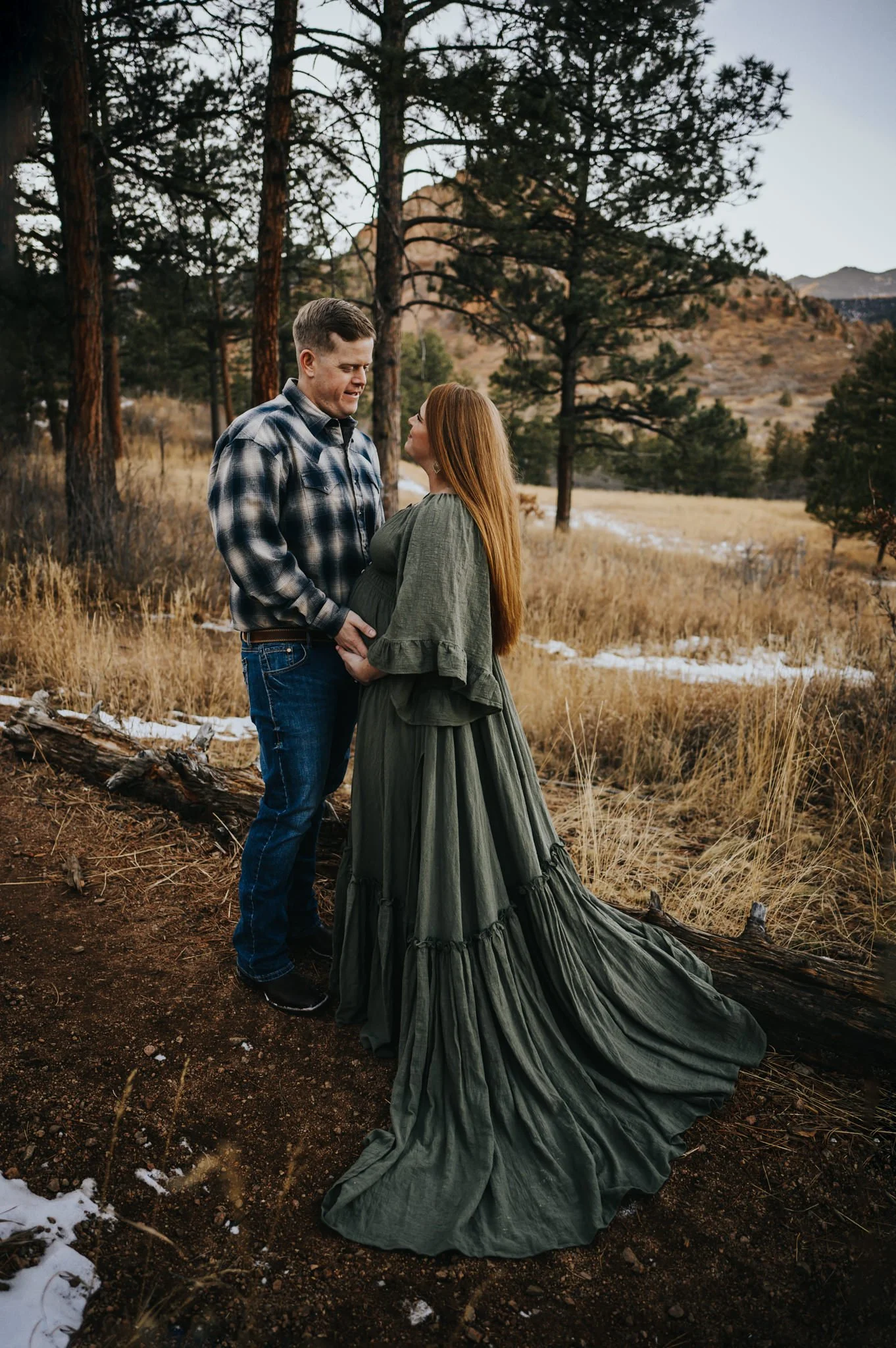 Expecting couple sharing a quiet moment during their maternity session in Cheyenne Canon.