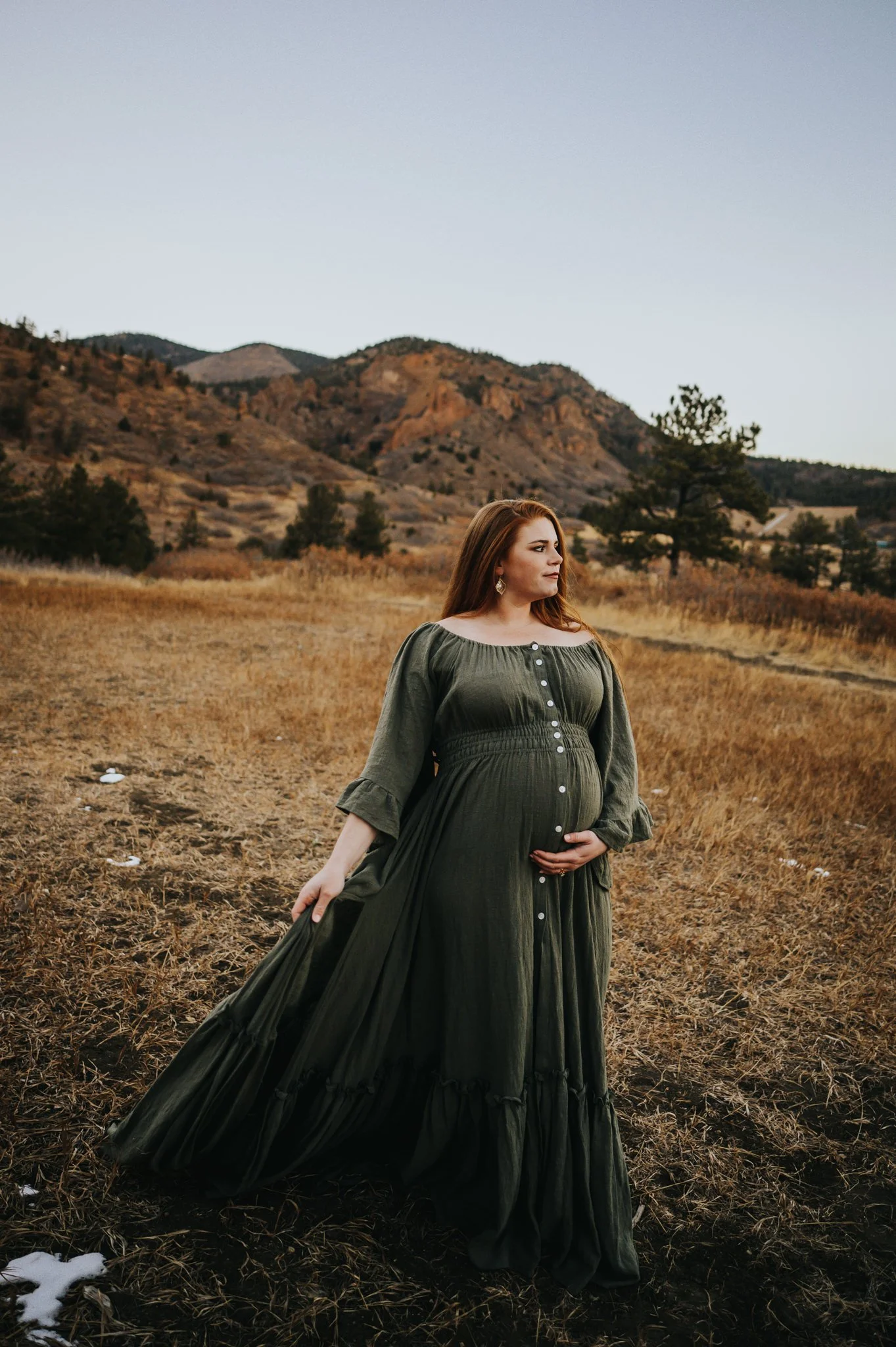 flowing-dress-sunsetPregnant woman in flowing dress with sunset light wrapping around her in Cheyenne Canon.