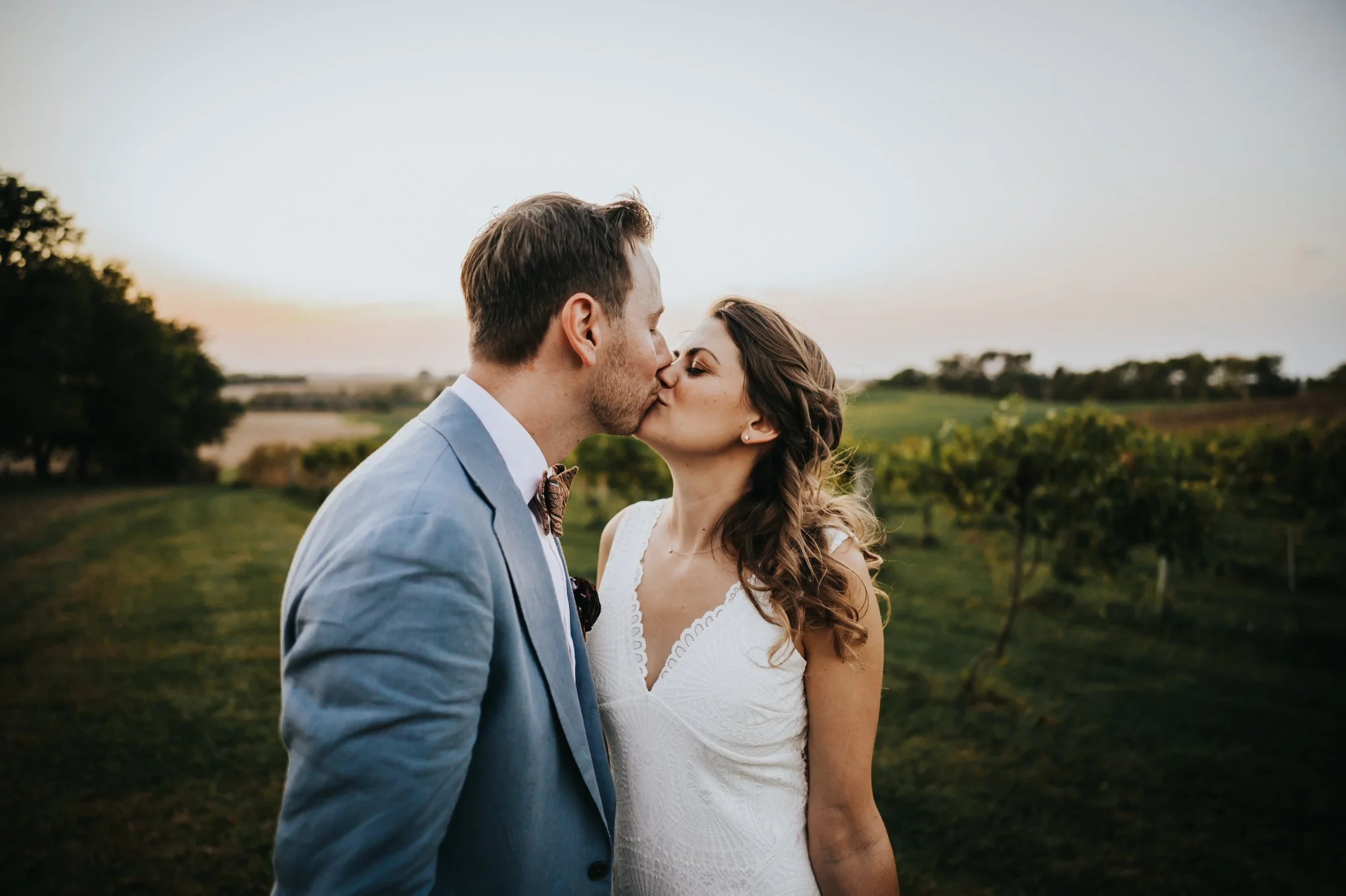 Bride and groom kiss after their wedding at Walker Homestead in Iowa CIty, Iowa.