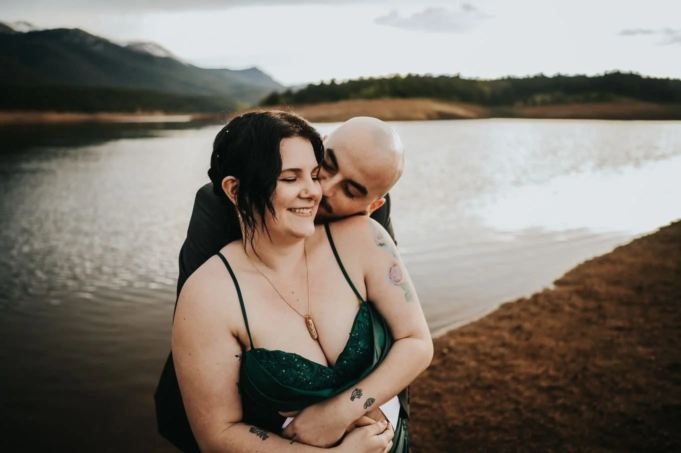 Rain, hail, and a whole lot of heart.

Zoie and Alex came from Missouri to elope on Pikes Peak, and Colorado brought the drama. 

After a downpour, a gift shop backup plan, and a last-minute pivot, they got married under cloudy skies by the water at 