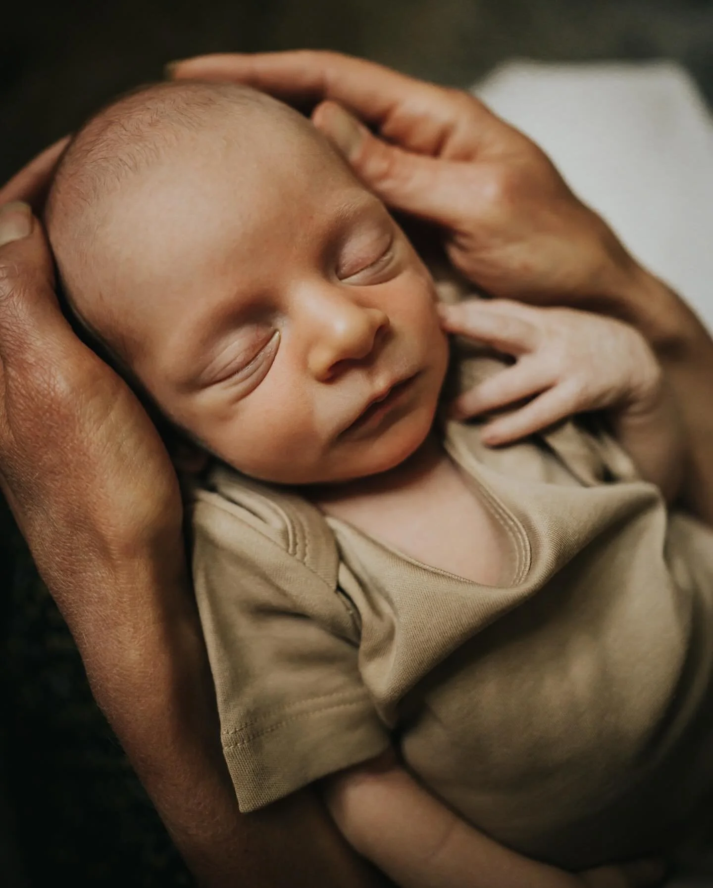 Sunrise in the tall grasses, soft light spilling into their home, and the sweetest kind of stillness that comes when a new baby is finally here.

Jenn and Brandon welcomed baby Levi with Arrow curled nearby, and I had the honor of photographing those