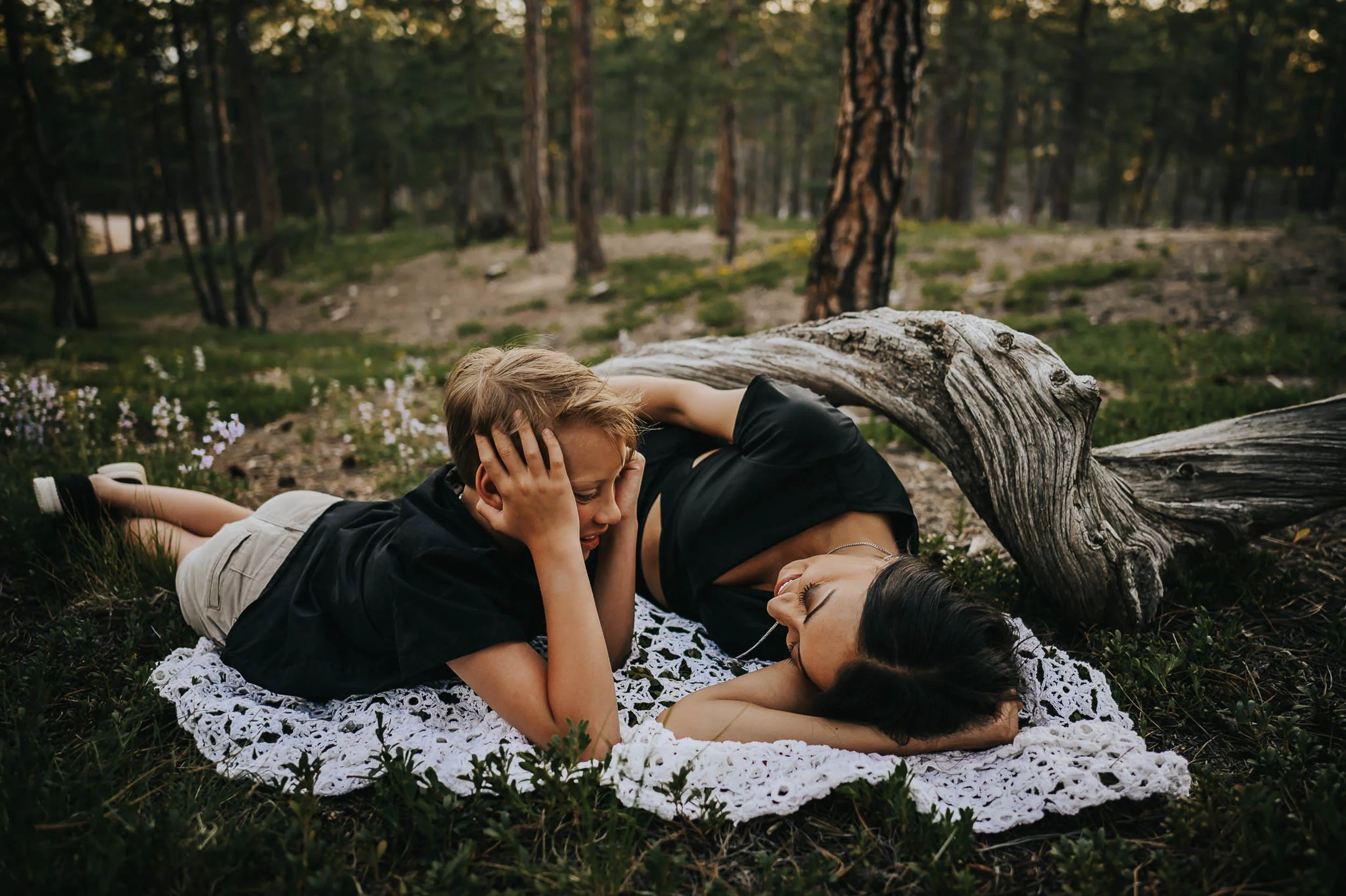 mom-son-lace-blanket-evergreen-trees.jpg