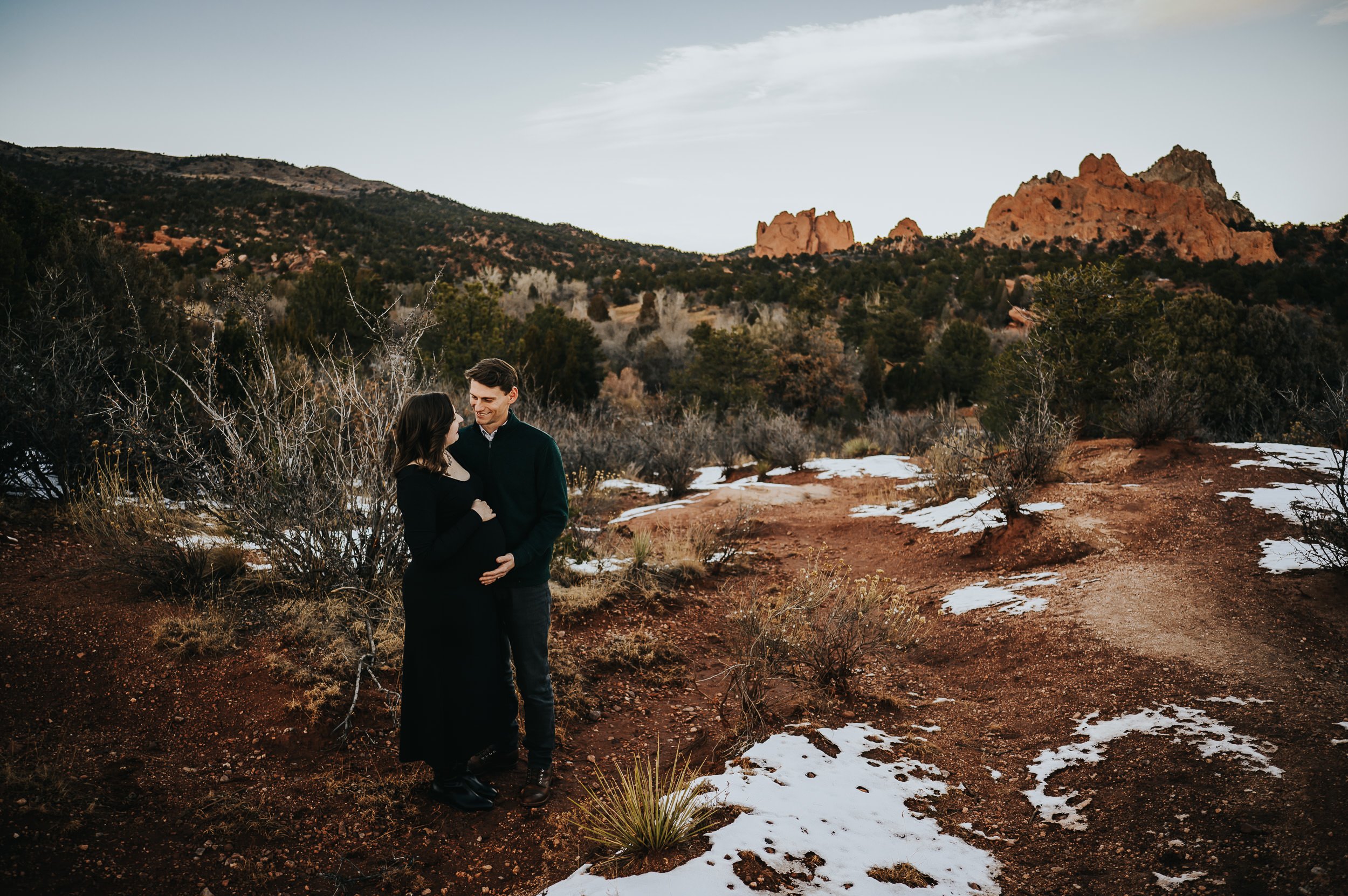 Couple sharing a quiet moment during their maternity session at Garden of the Gods.