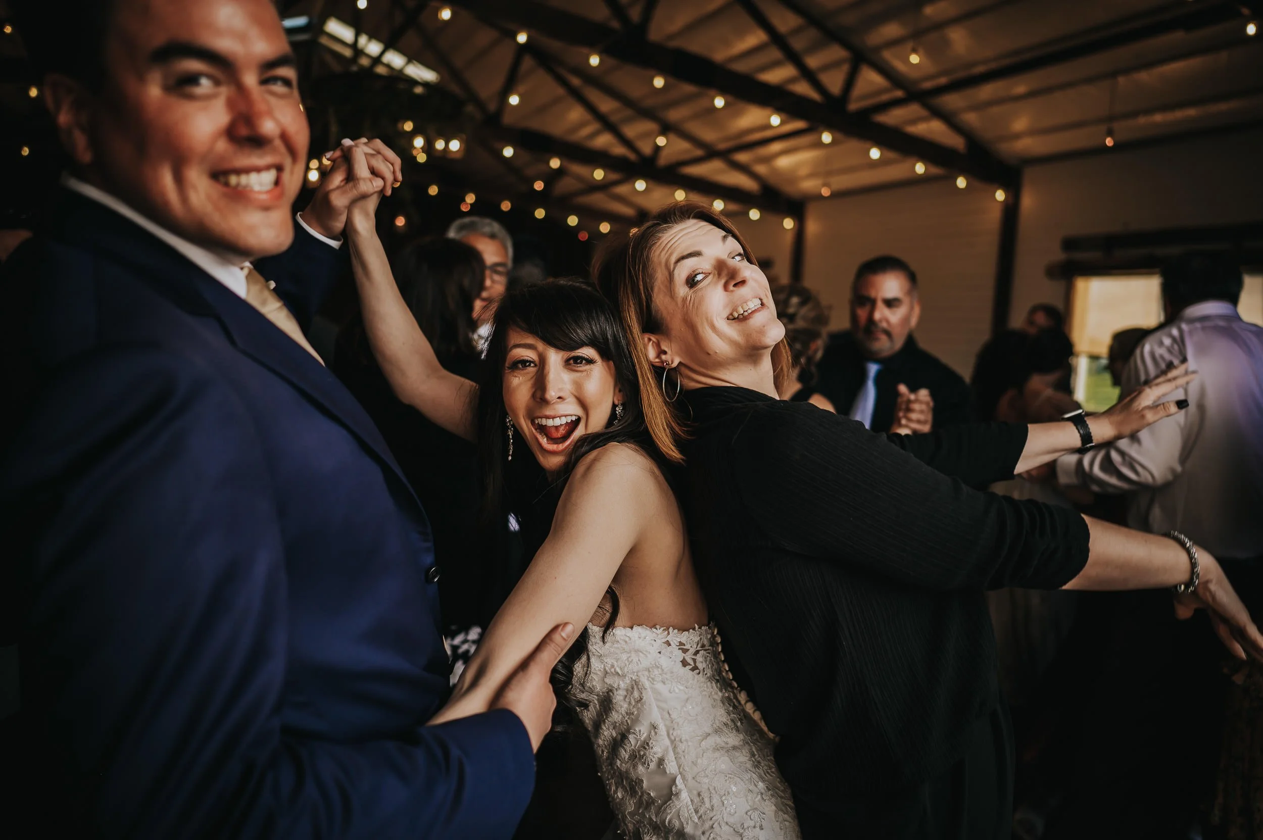 Wedding party celebrating together at Younger Ranch in Colorado Springs.