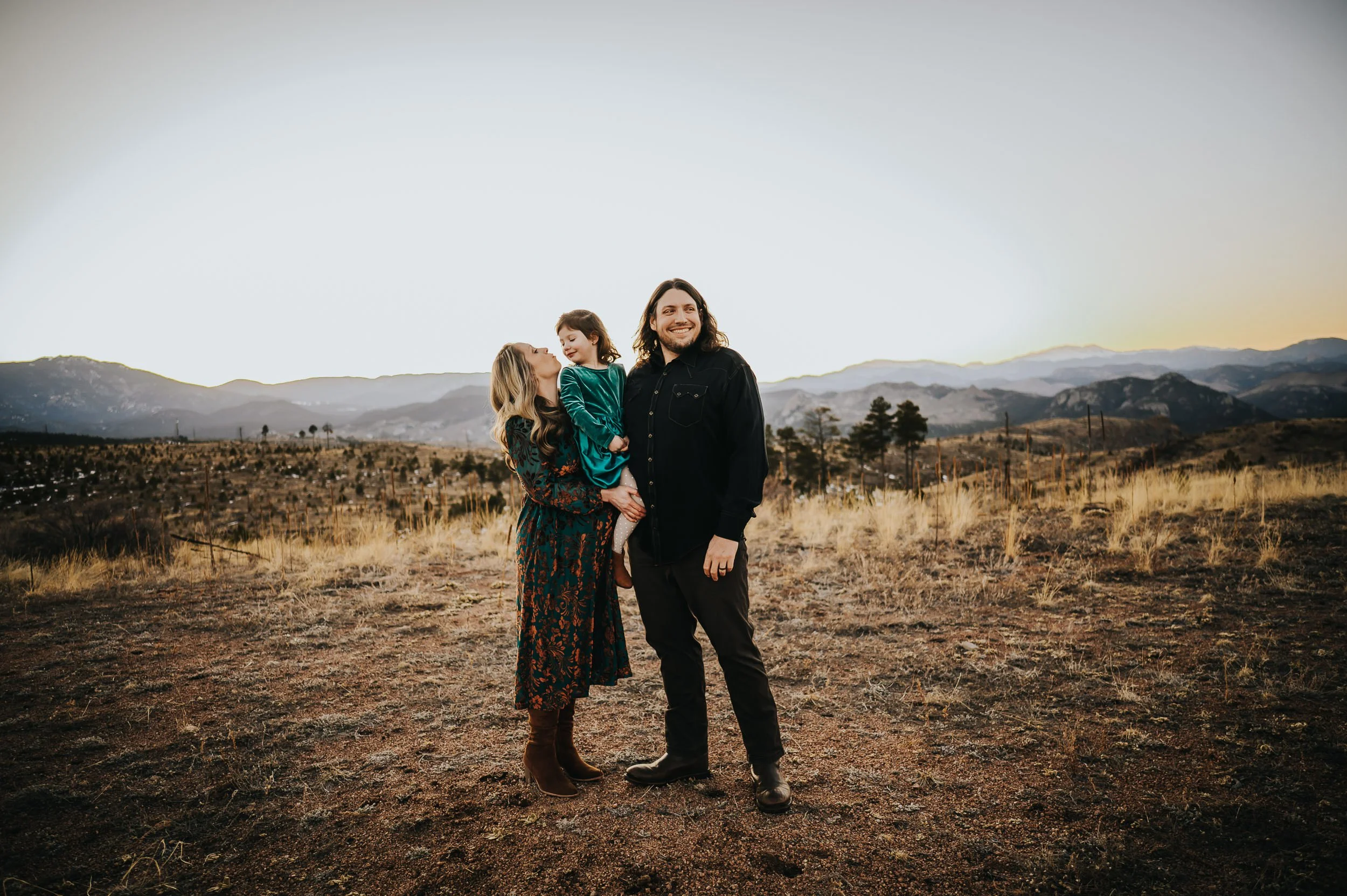 Maternity session including toddler and parents in the Colorado mountains