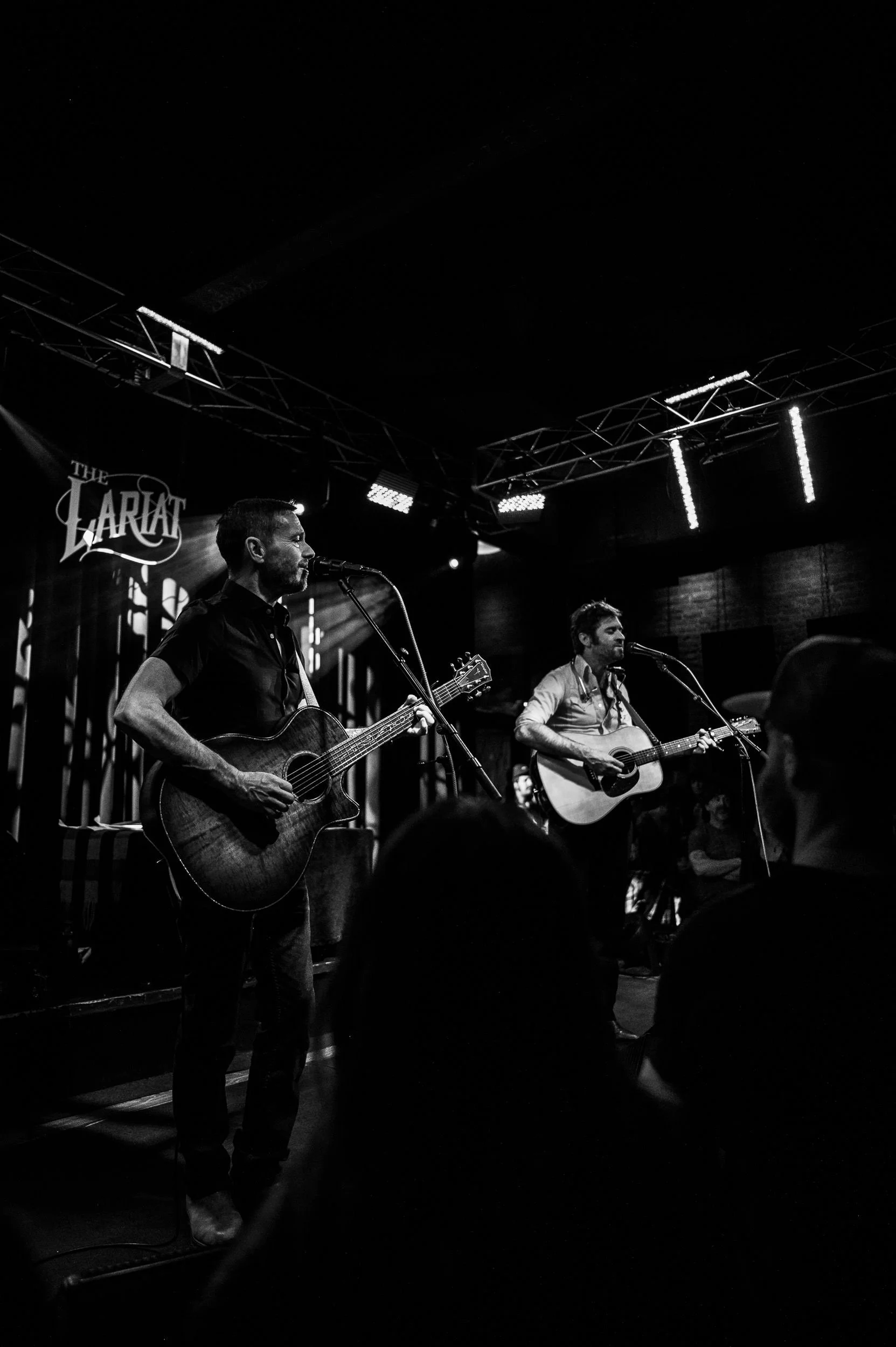 John Craigie sharing stories and music during an intimate live concert in Colorado.