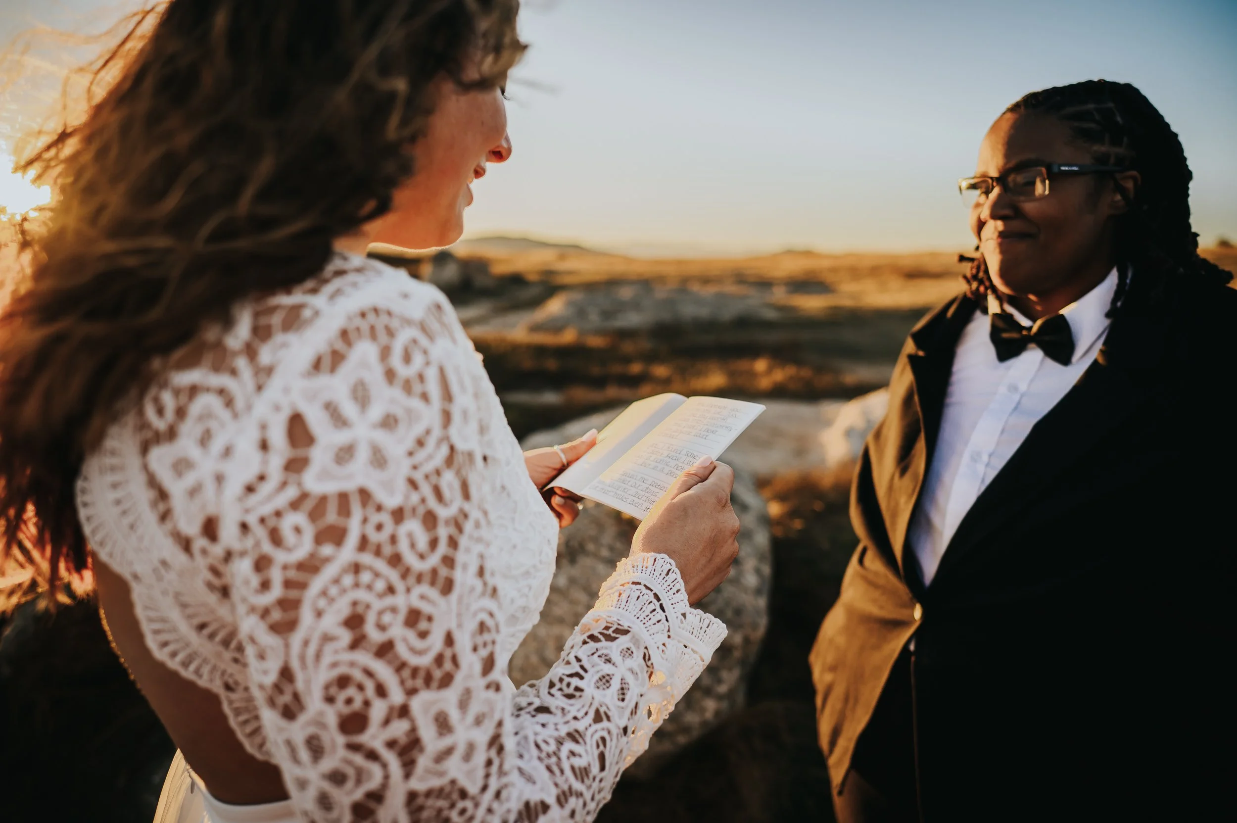 Bride speaking her vows during an intimate mountain elopement ceremony.