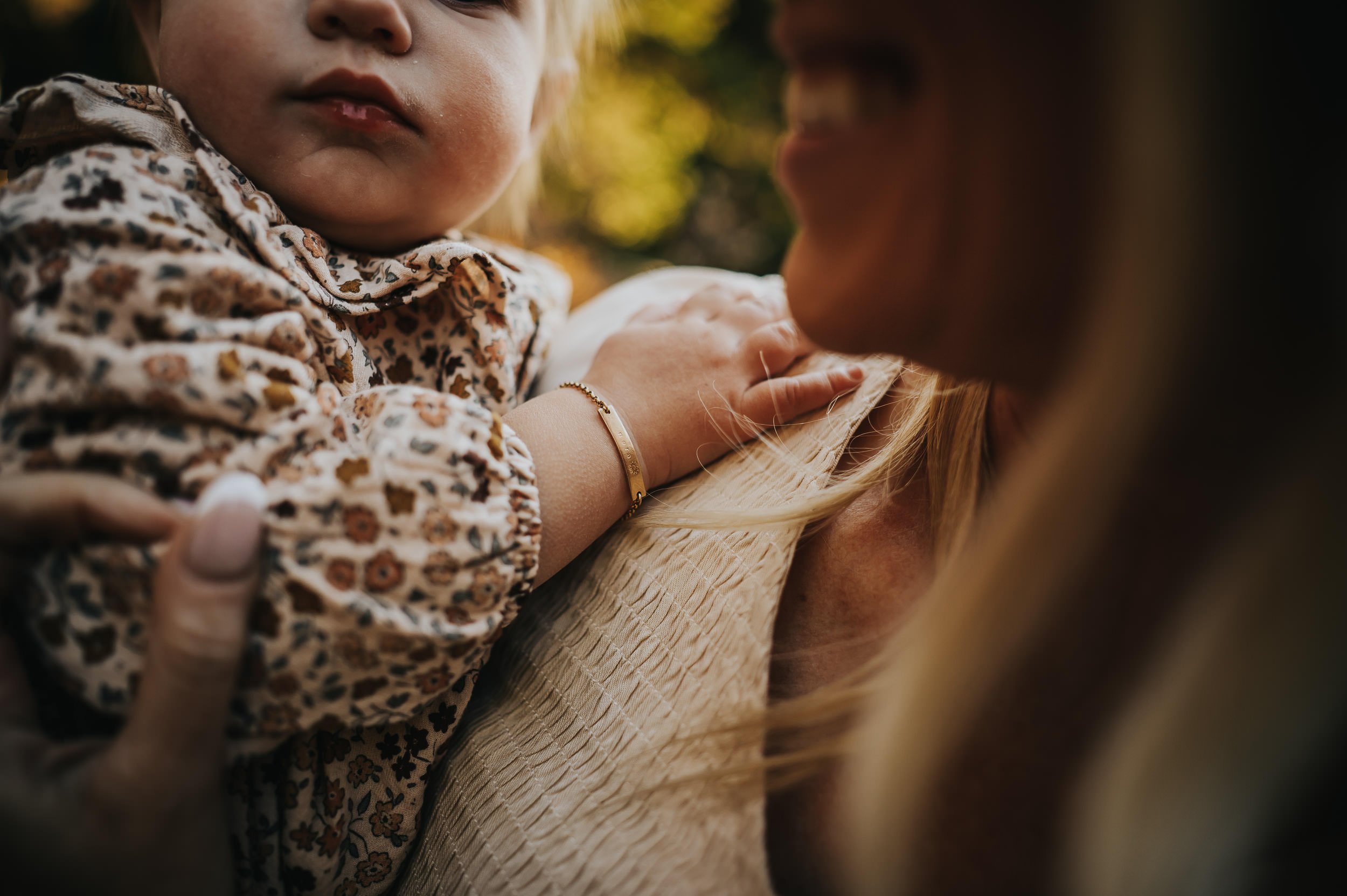 Family silhouetted against glowing sky during golden hour at Brainard Lake in Colorado.