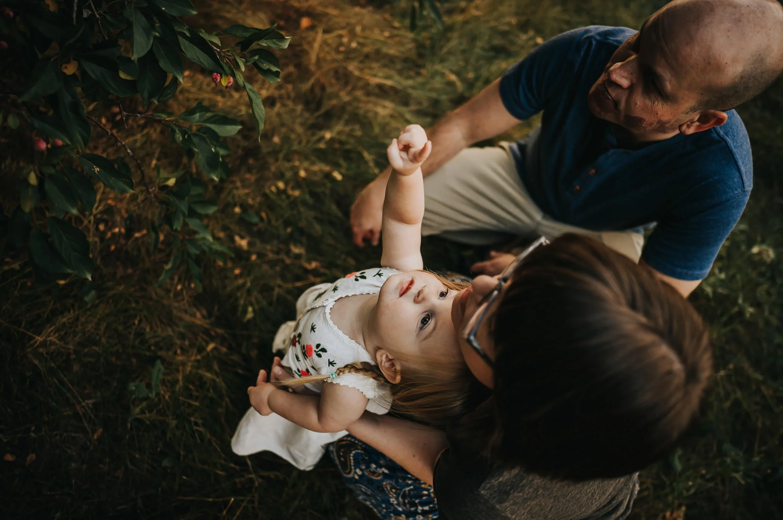 Family together during a golden light family photography session at a Denver park.