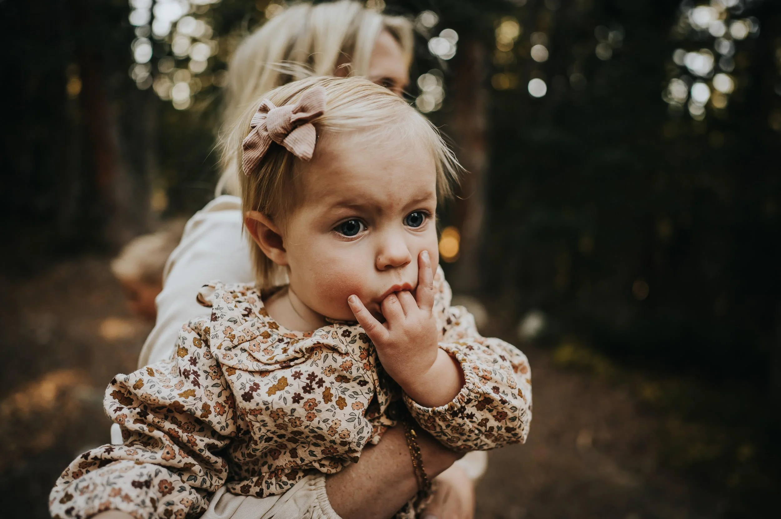 Family walking together along the lakeshore at Brainard Lake with soft evening light.
