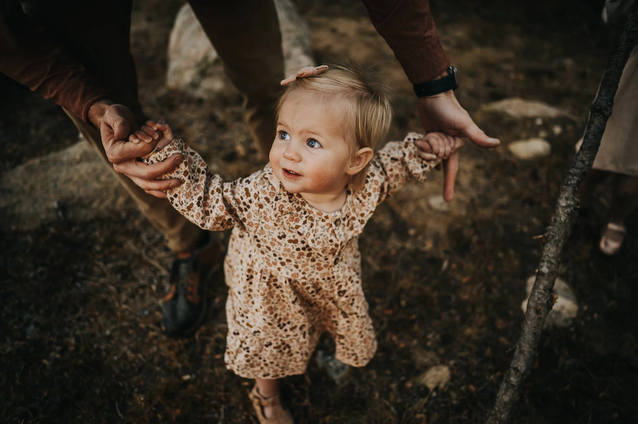 Parents hugging their children closely during a relaxed family session at Brainard Lake.