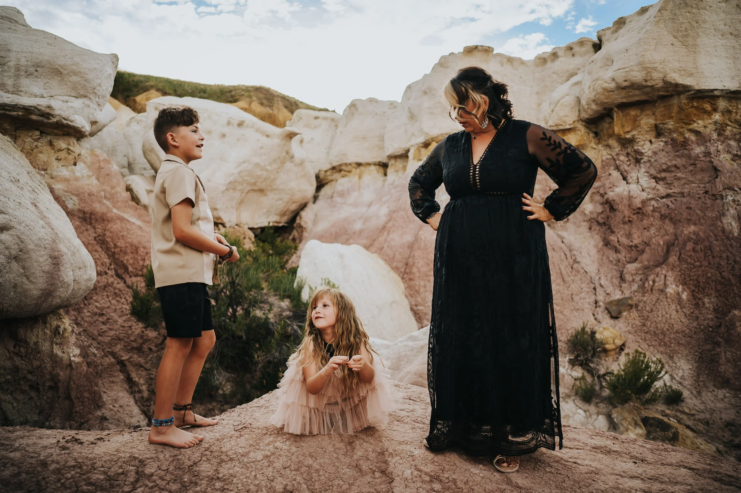 A family of three talks during their time together at The Paint Mines during their family photography session.
