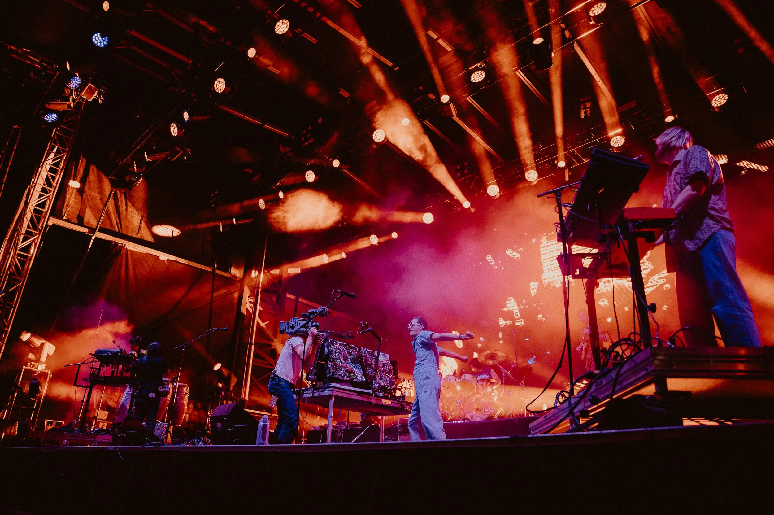 Wide shot of King Gizzard on stage at Field of Vision festival.