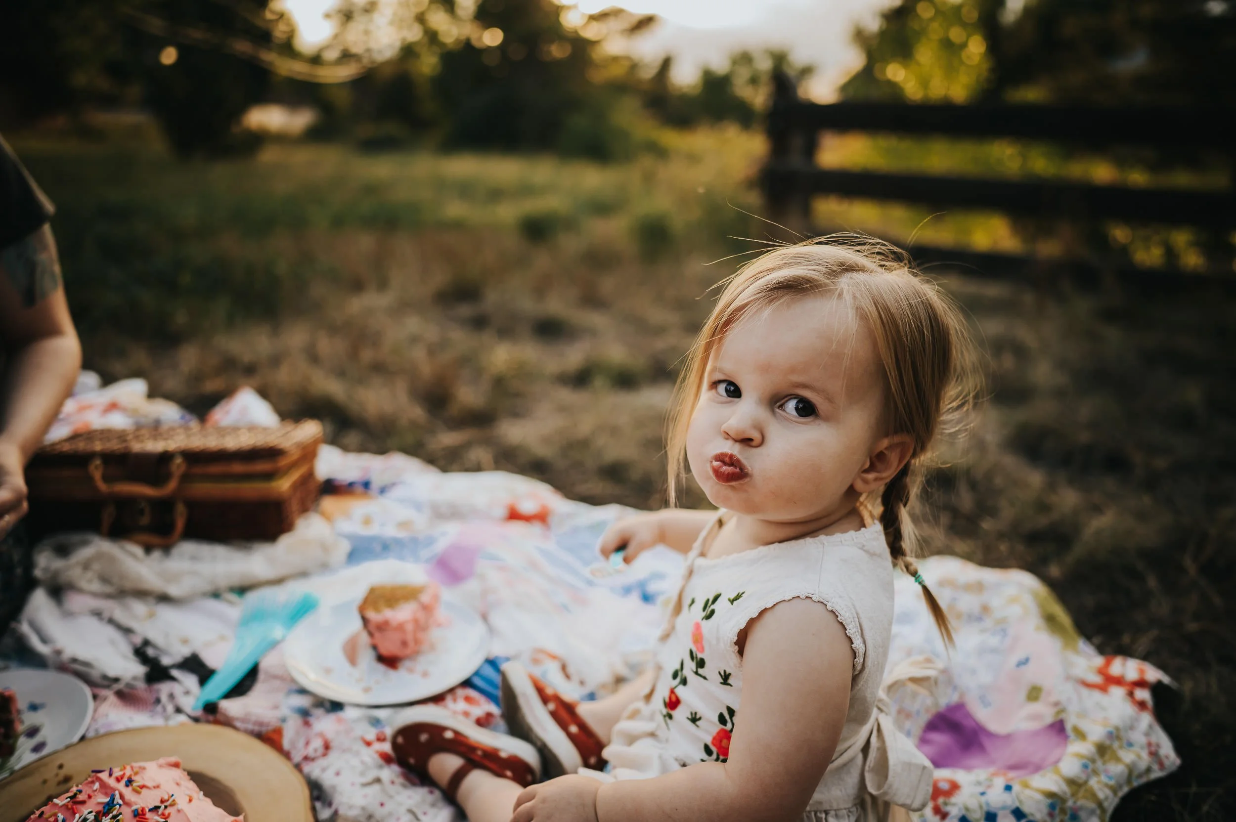 Grandparents sharing a joyful moment with their granddaughter during a family session in Denver.
