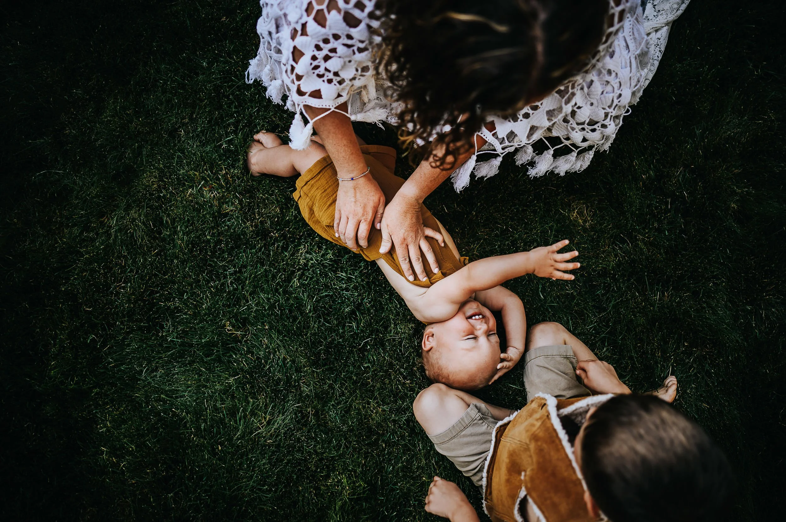 boy-laughing-with-mom-lace-dress.jpg