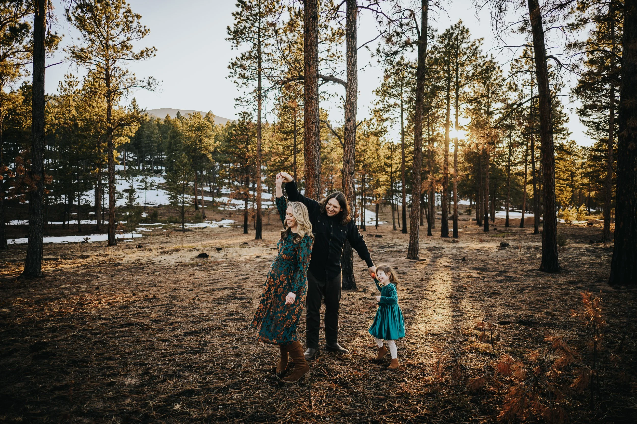 Expecting couple photographed during a maternity session in the Colorado mountains