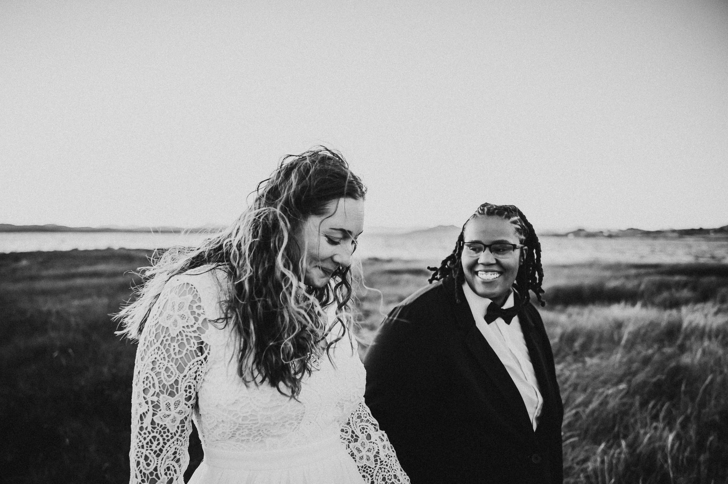 Newly married couple laughing together after their Colorado mountain elopement.