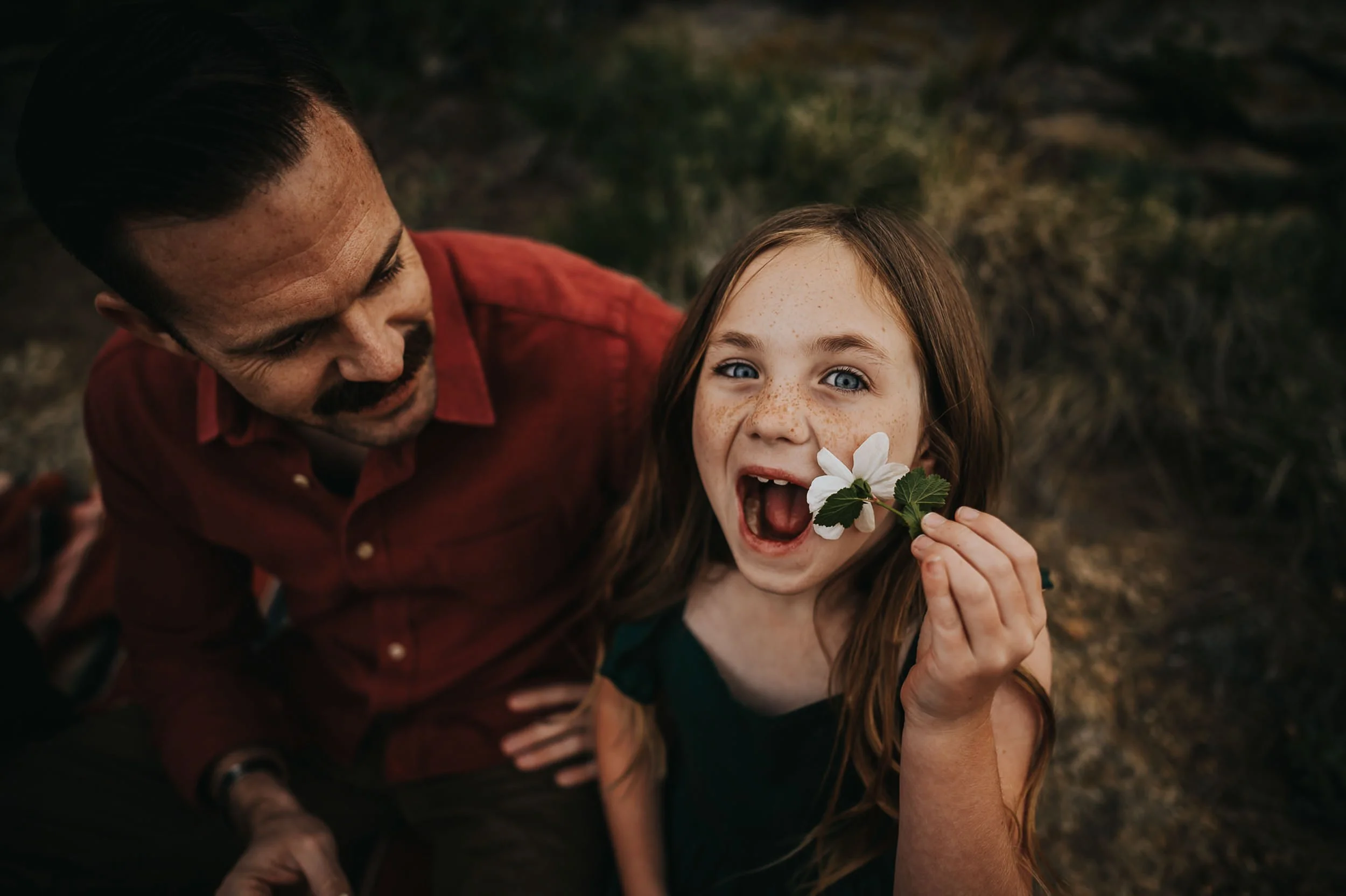 dad-daughter-holding-flower-smiling.jpg