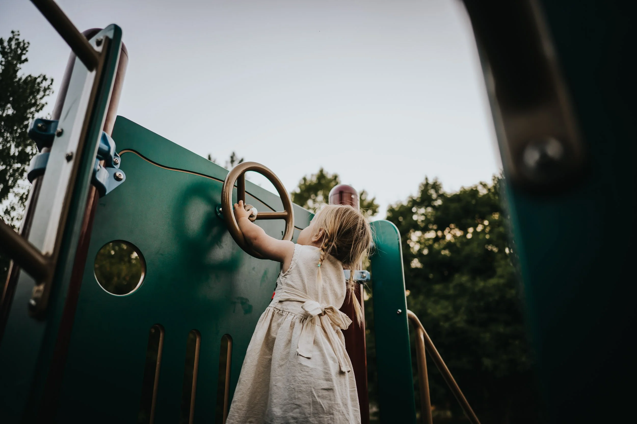 Two-year-old toddler celebrating her birthday during a family photography session in Denver.