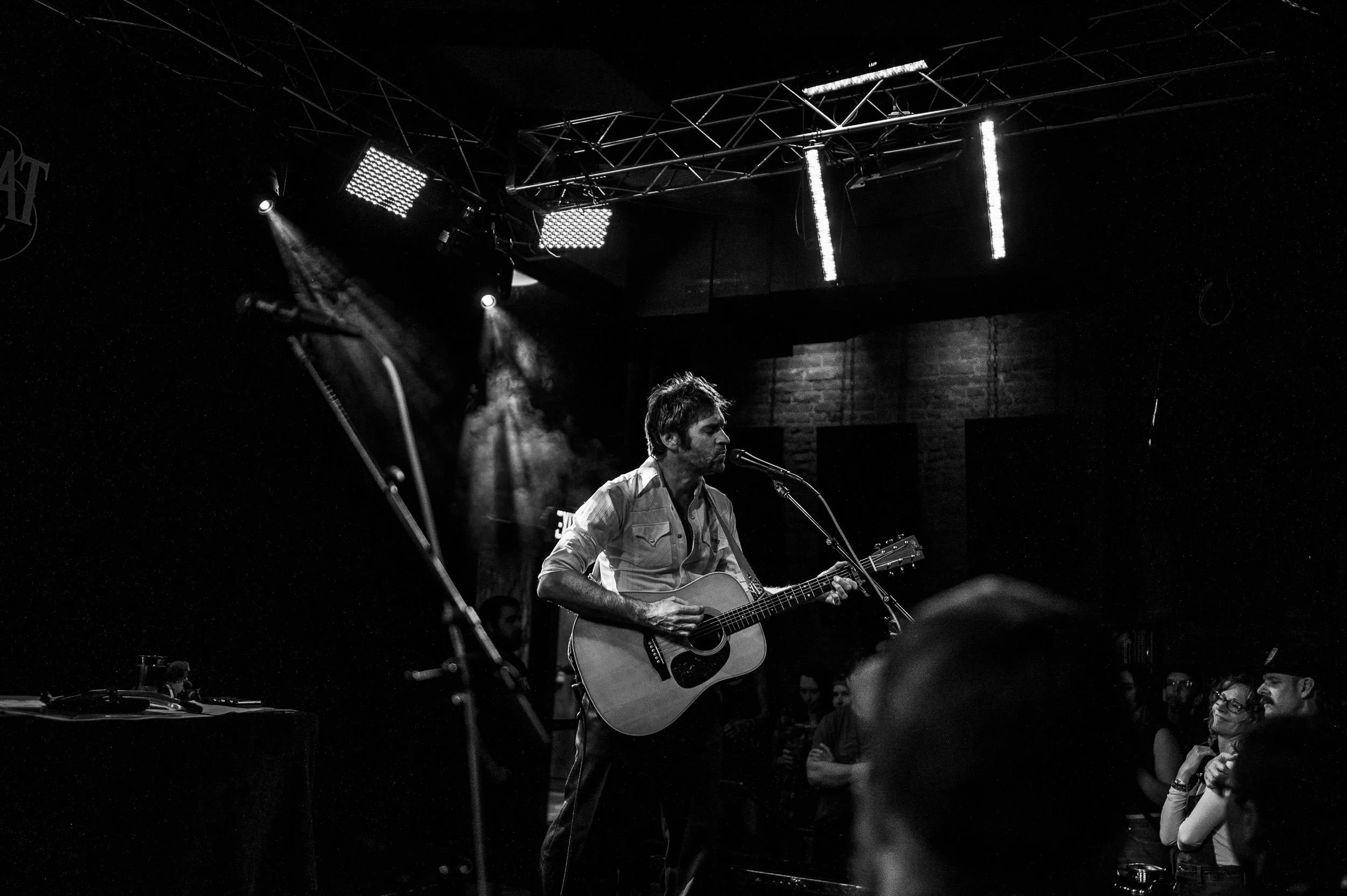 Intimate live music setting inside The Lariat during John Craigie’s performance.