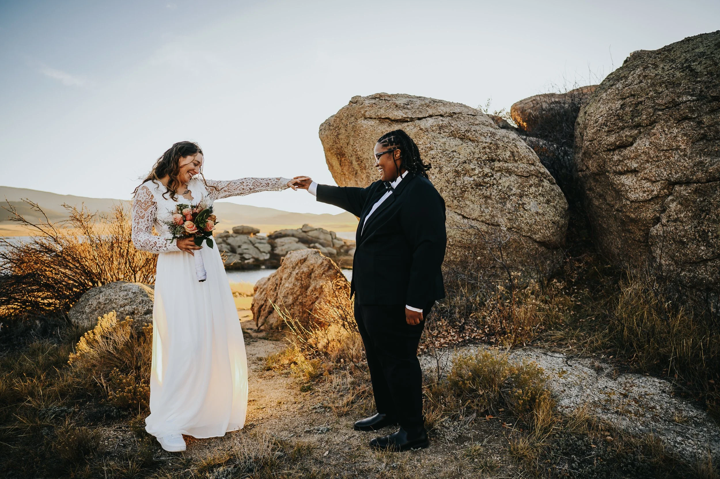 Couple exchanging vows in an open mountain meadow near Lake George, Colorado.