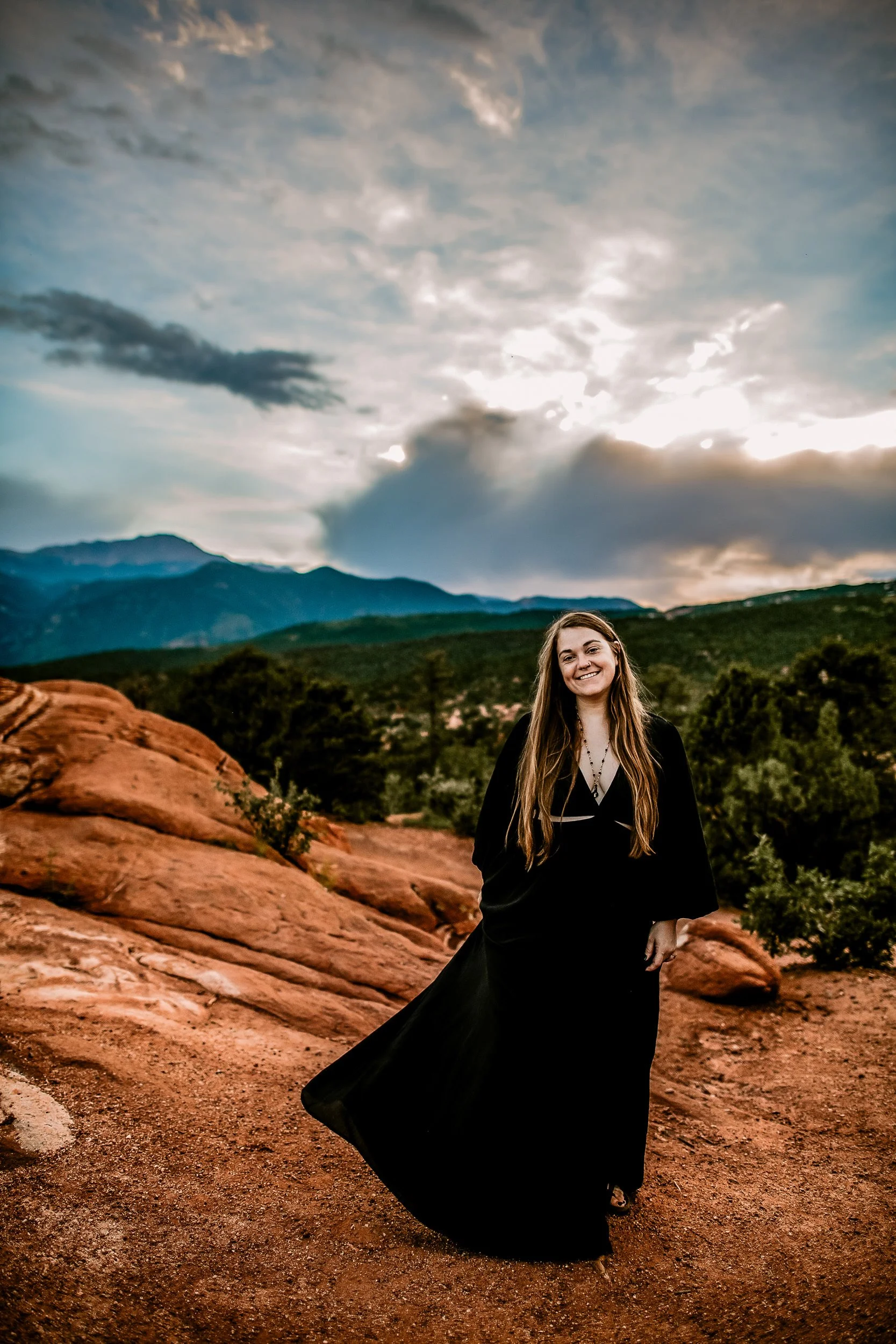 Sandy, Colorado Springs wedding photographer, laughing among the red rock formations at Garden of the Gods.
