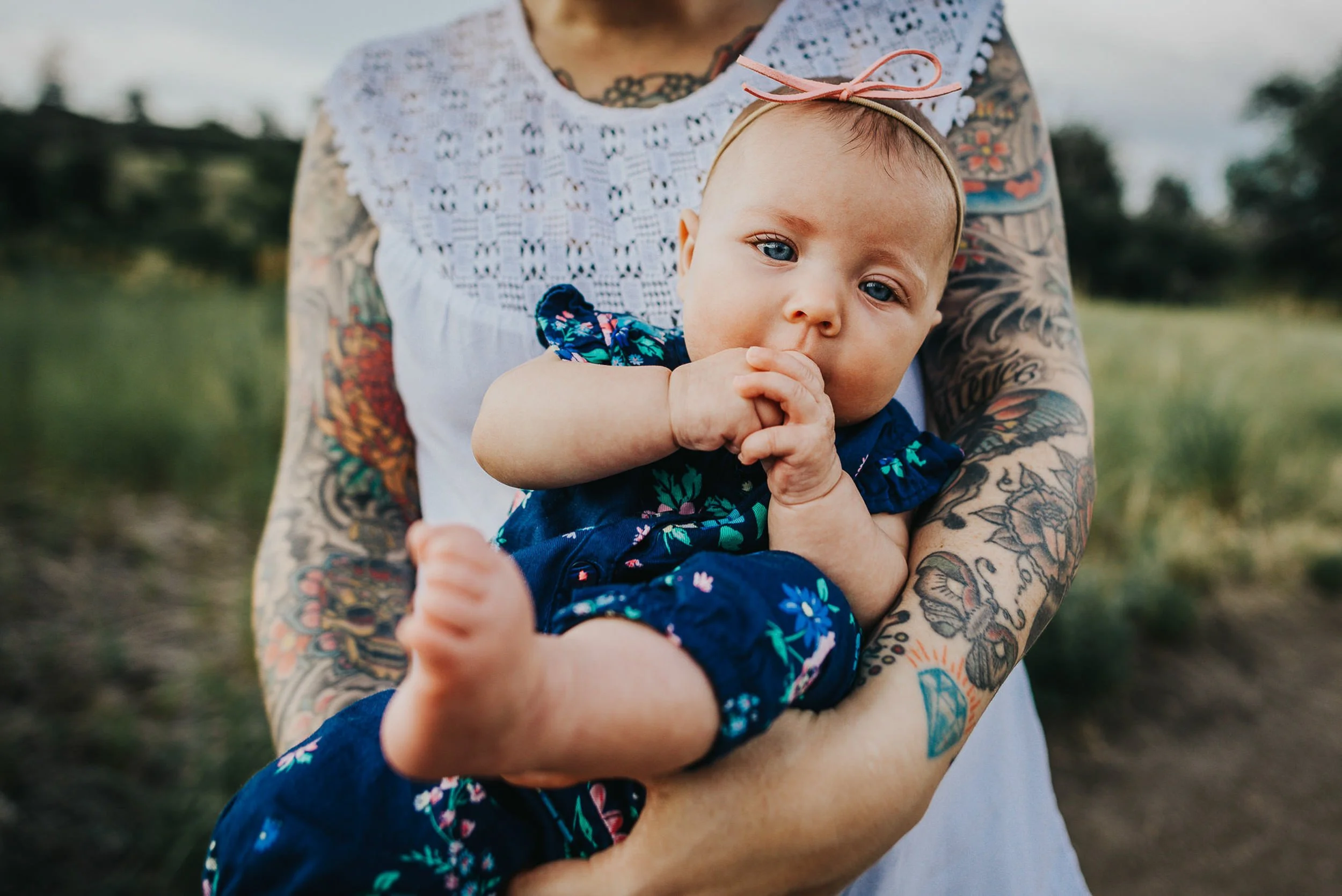 baby-tattooed-mom-holding-mountains.jpg