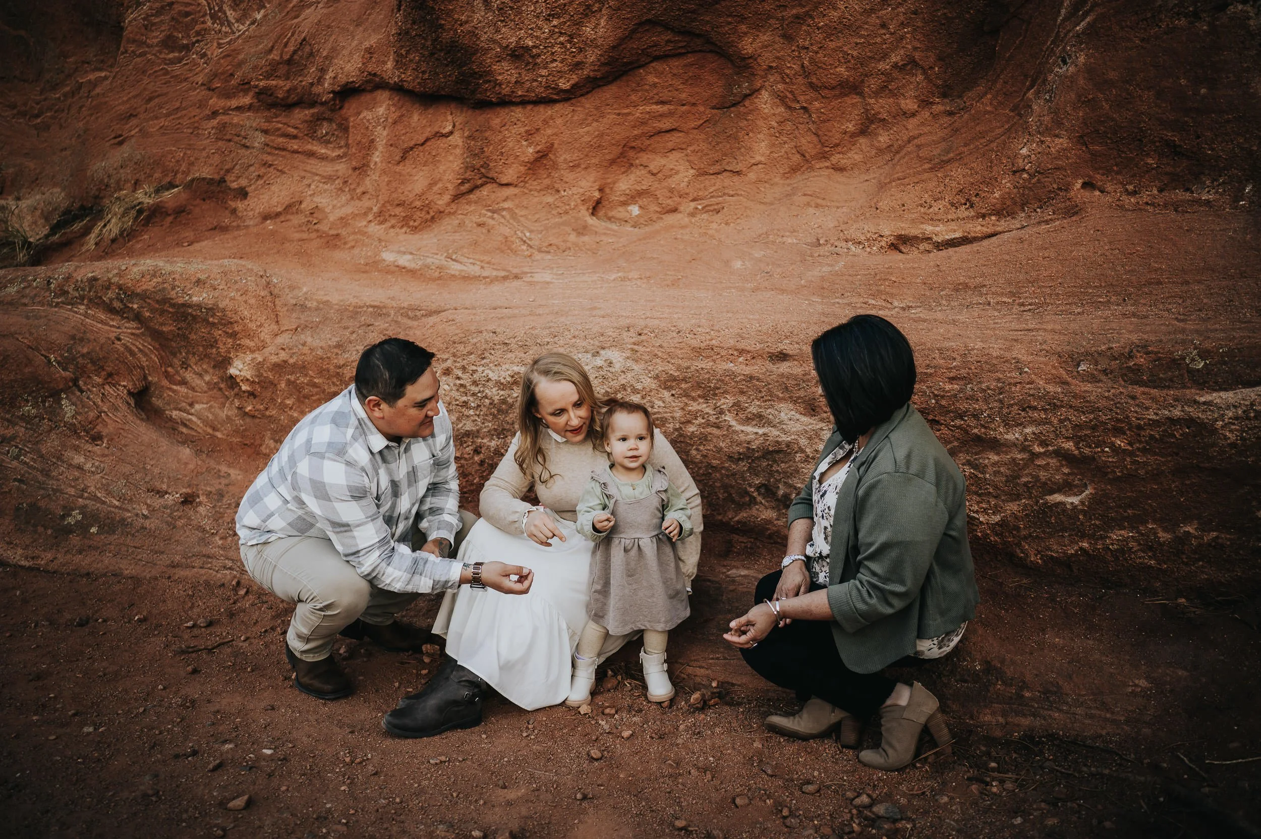 Two-year-old toddler celebrating her birthday during a family photography session at Red Rock Canyon.