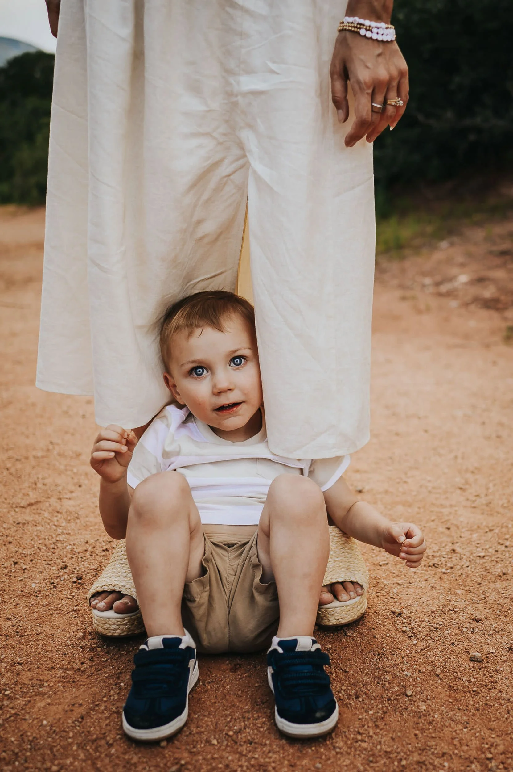 boy-hides-in-moms-dress.jpg