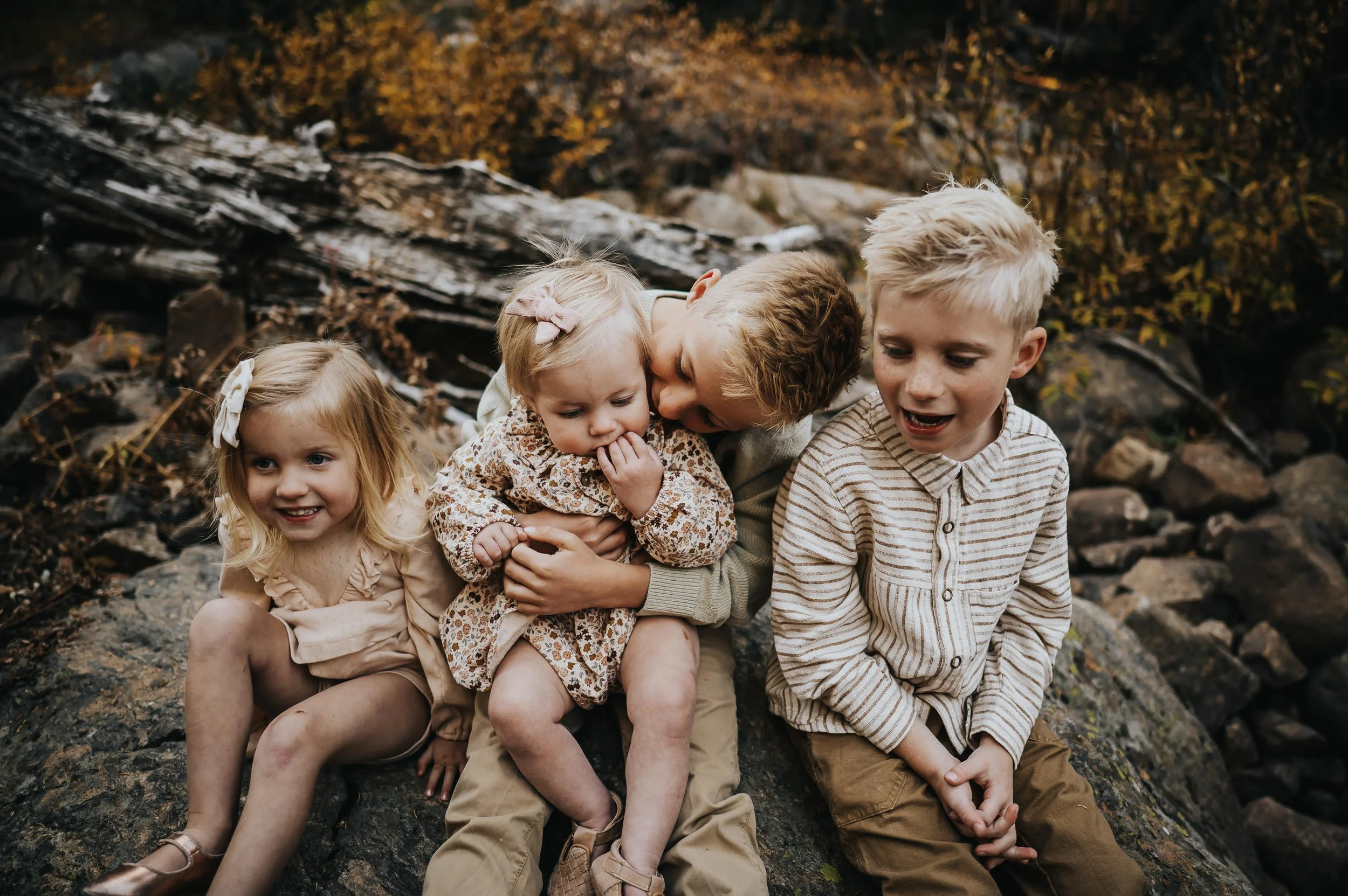 Candid family moment with laughter and movement during a golden hour session at Brainard Lake.