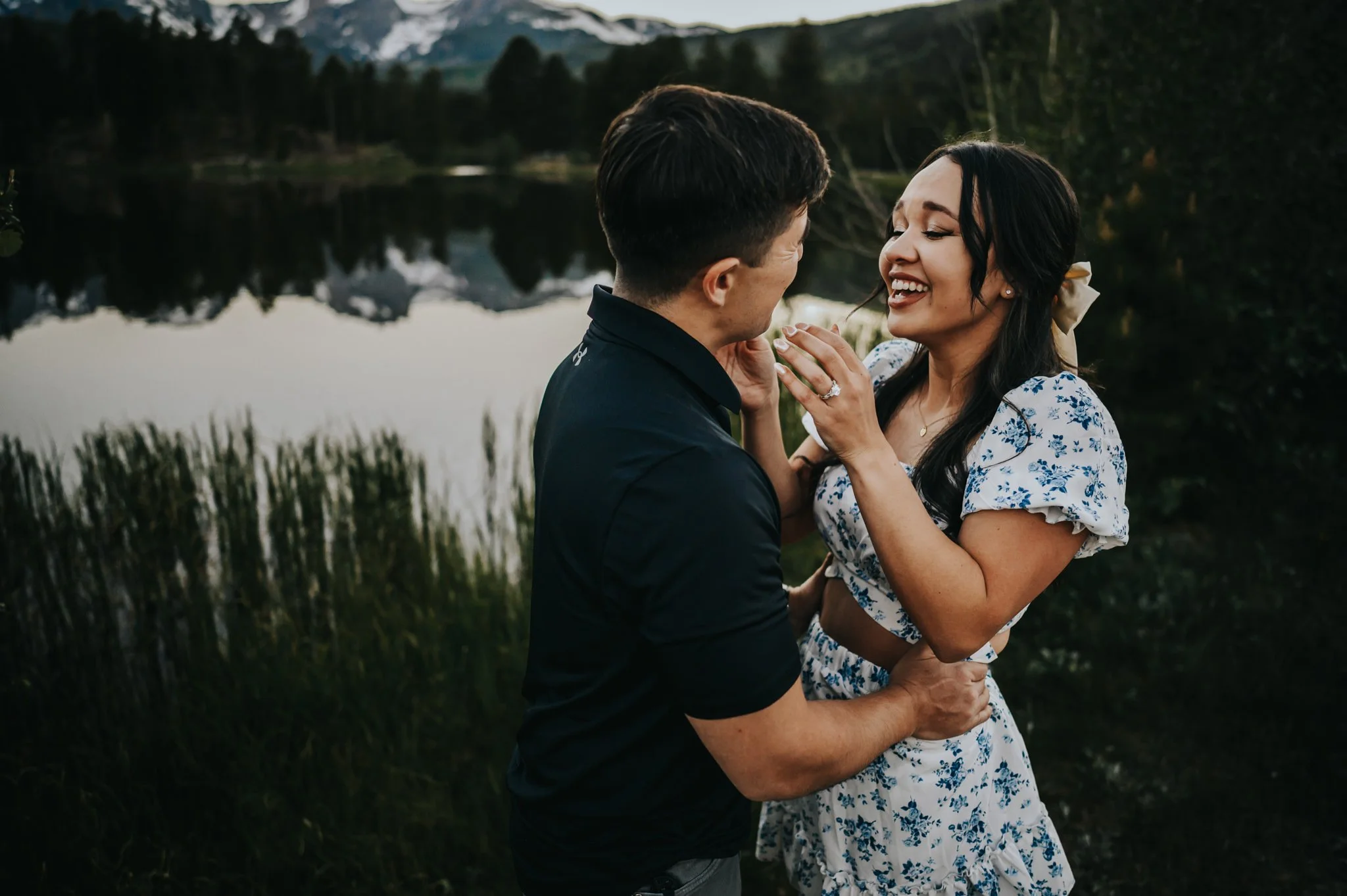 A woman is surprise and overjoyed after her partner proposed to her at Sprague Lake in Rocky Mountain National Park.