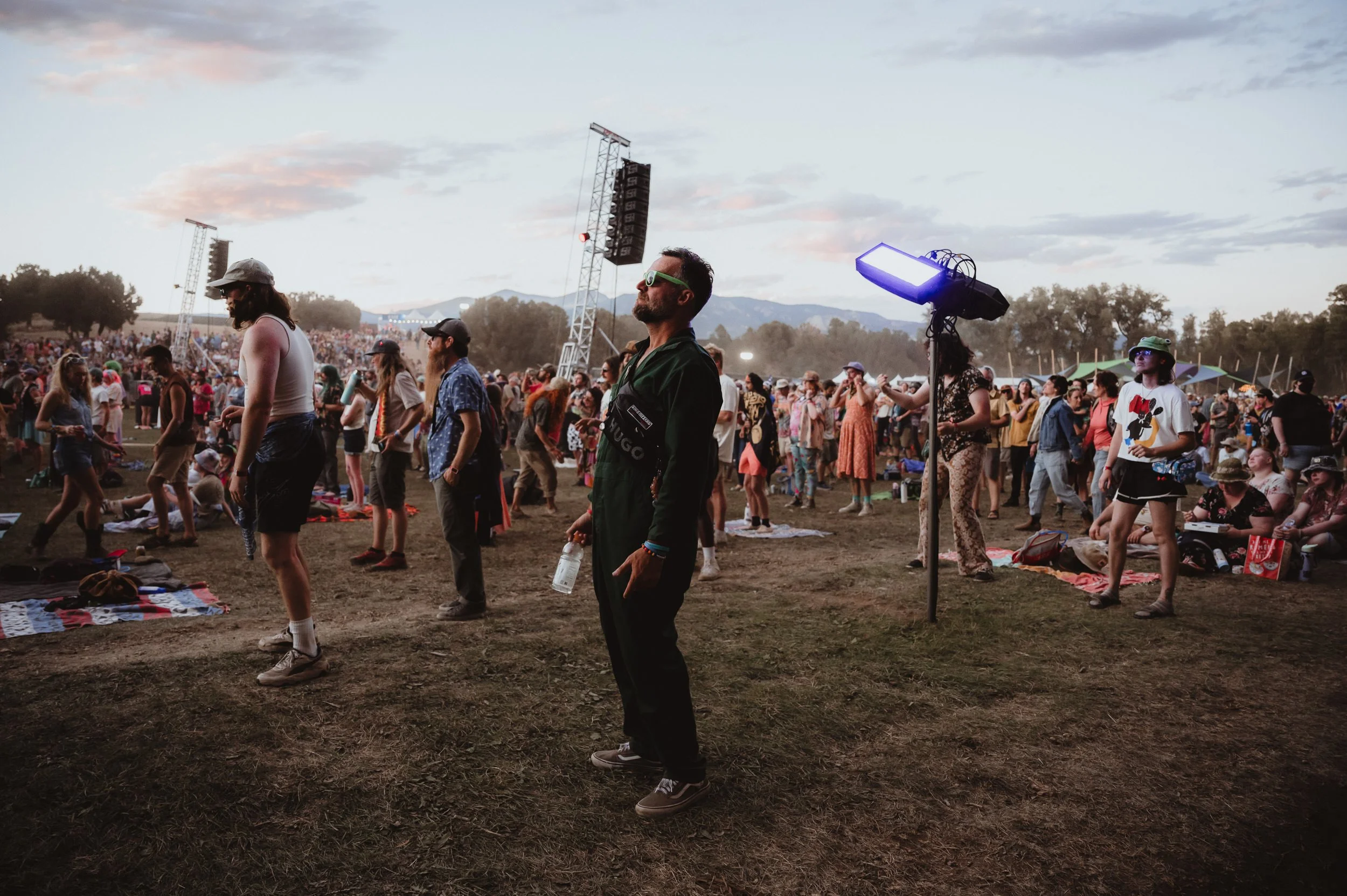 Festival goer in awe of King Gizzard performance at Field of Vision Meadow Creek.