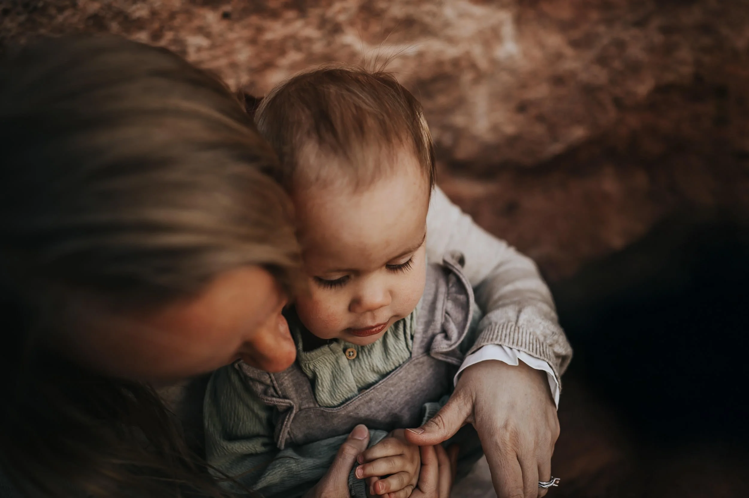 Extended family gathered together during a golden hour session at Red Rock Canyon Open Space in Colorado Springs.