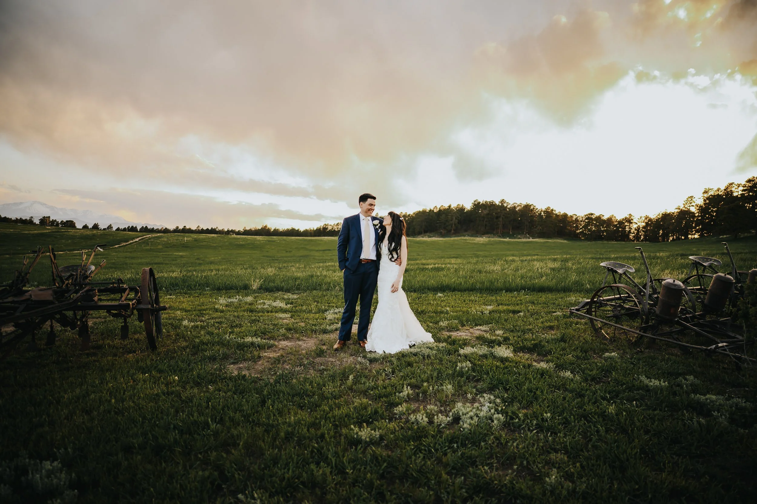 Wedding portraits at Younger Ranch with sweeping Pikes Peak views.