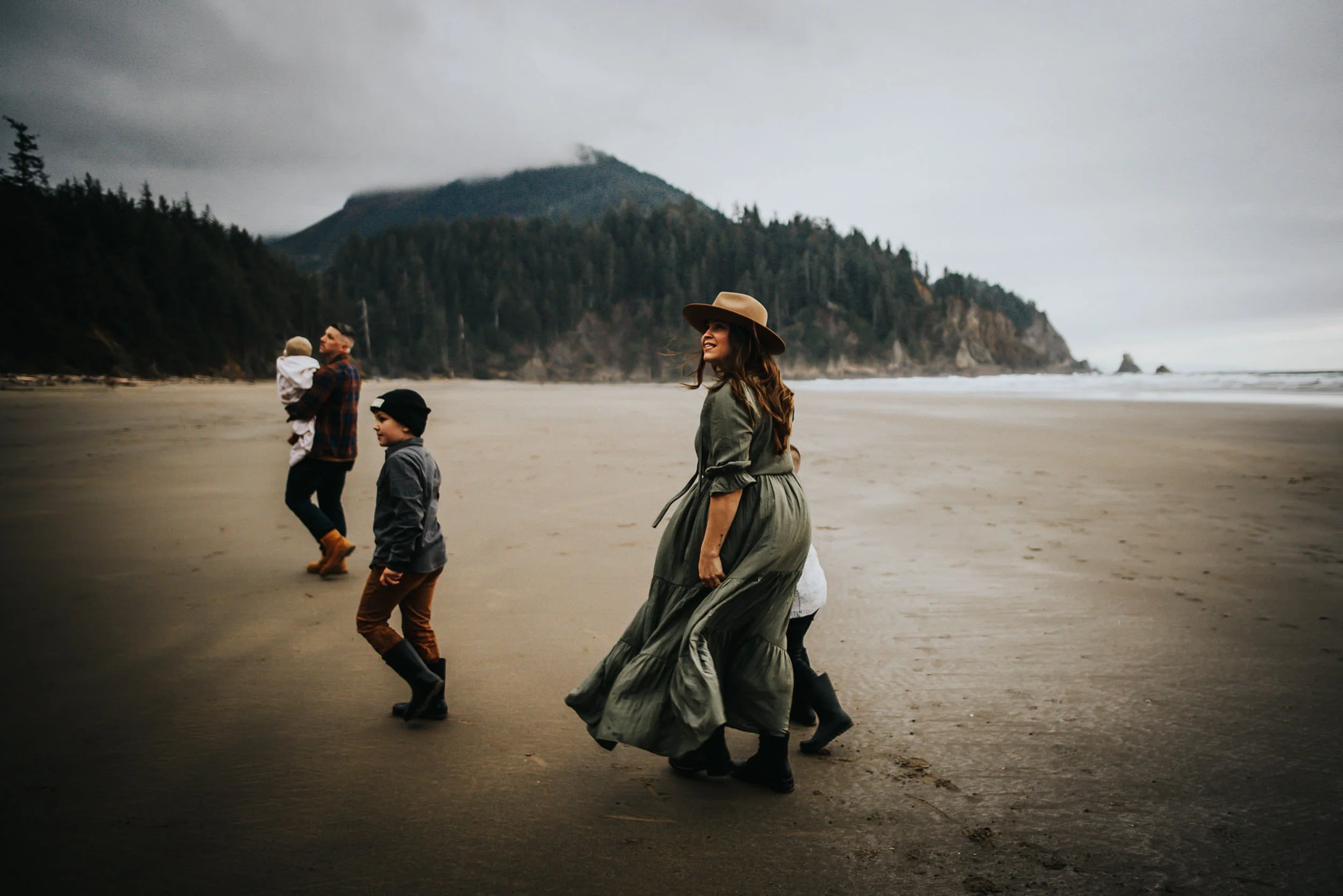 family-walking-shoreline-overcast-rain.jpg