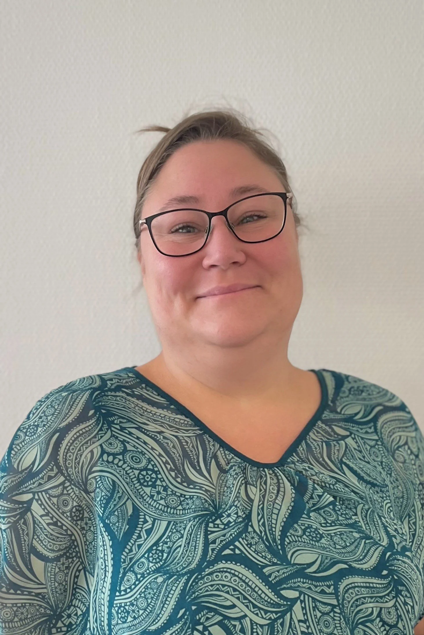 woman with glasses and hair set up