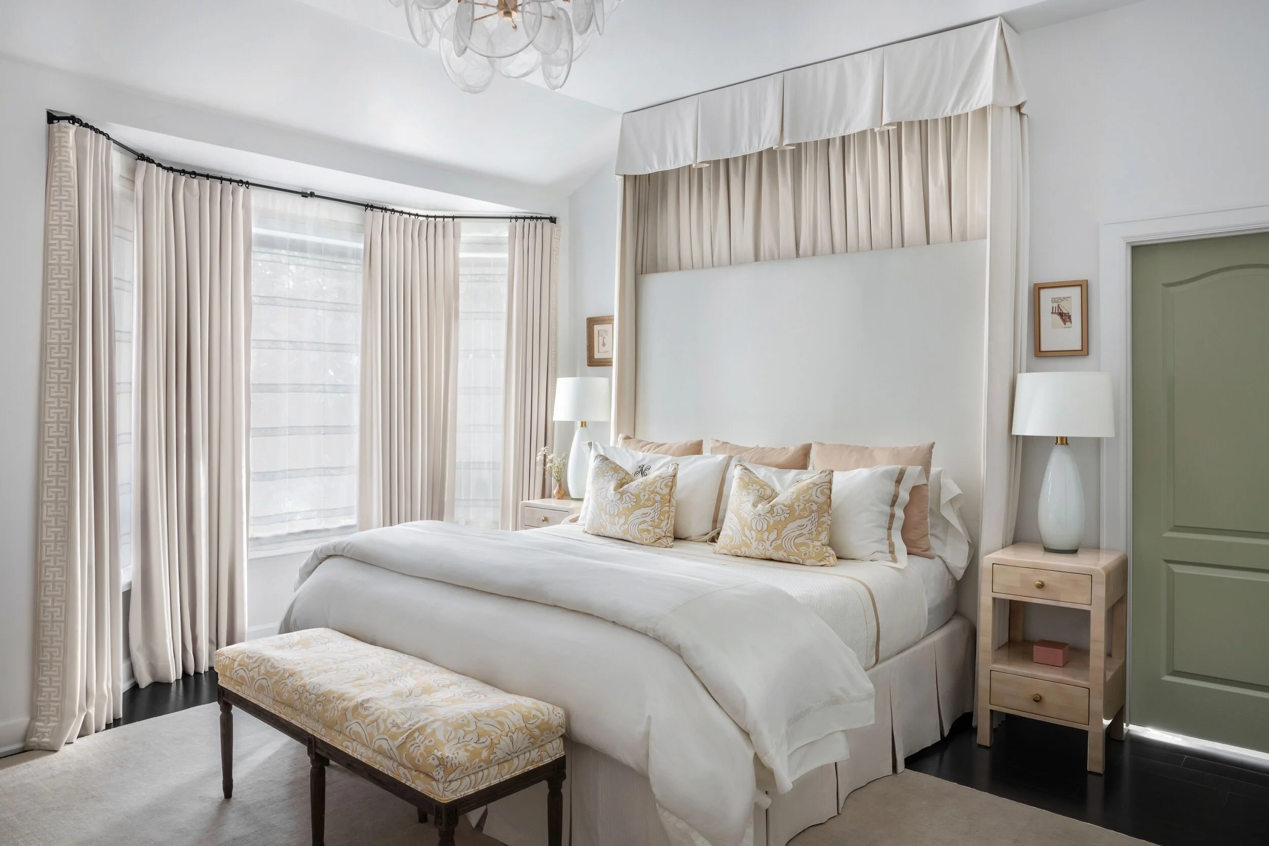 Soothing neutral bedroom with floor to ceiling headboard