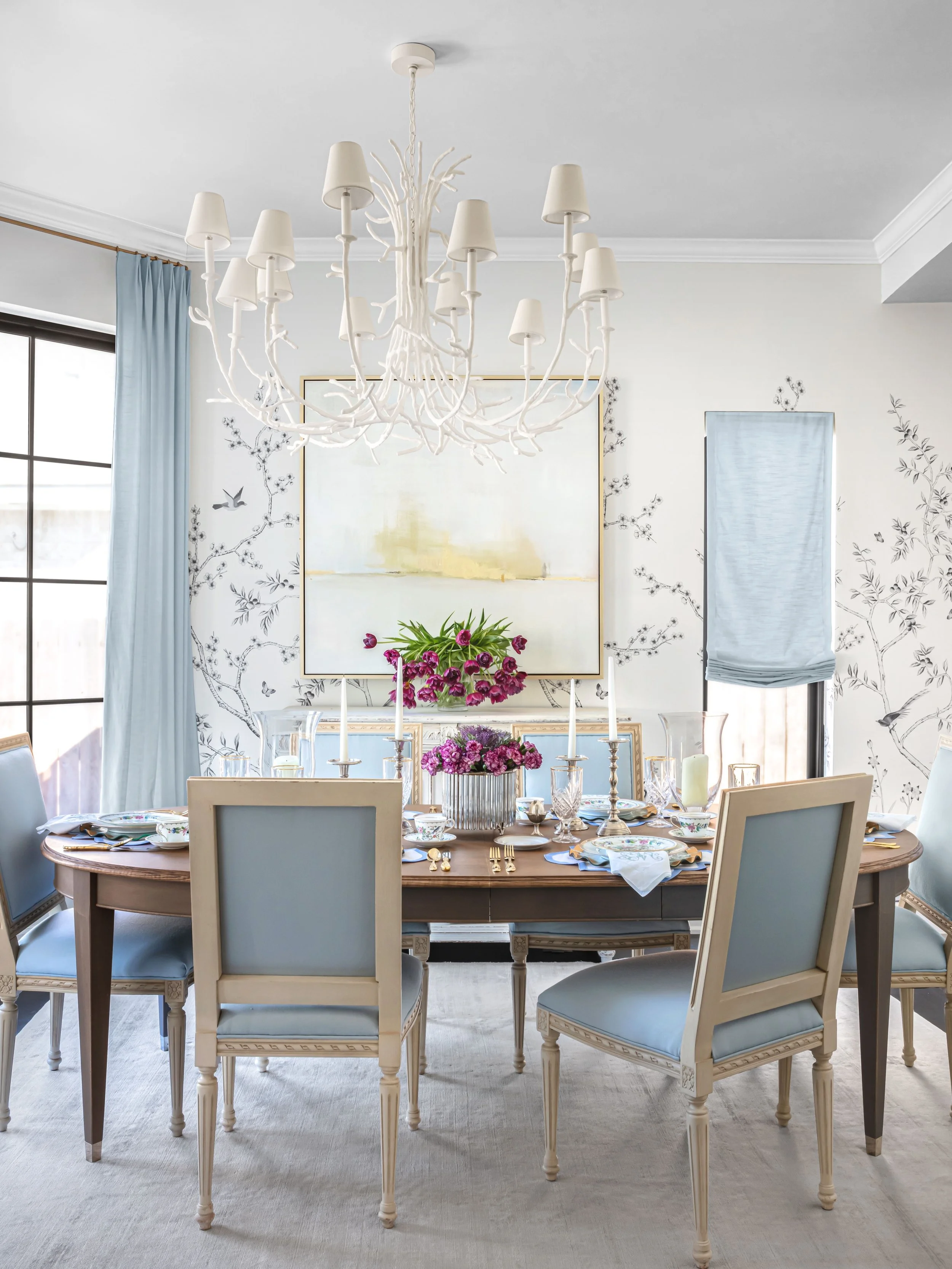 Some rooms ask to be filled. This one asked to be gathered in.

The dining room in this home carries the same quiet logic as everything around it &mdash; a palette of neutrals and soft blues, a table meant to hold both a Tuesday dinner and a holiday 