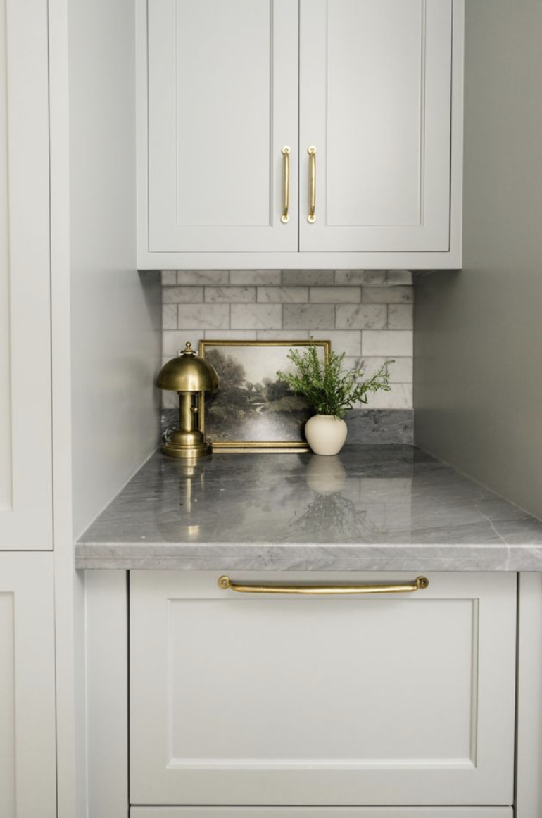 Kitchen with gray countertop and backsplash