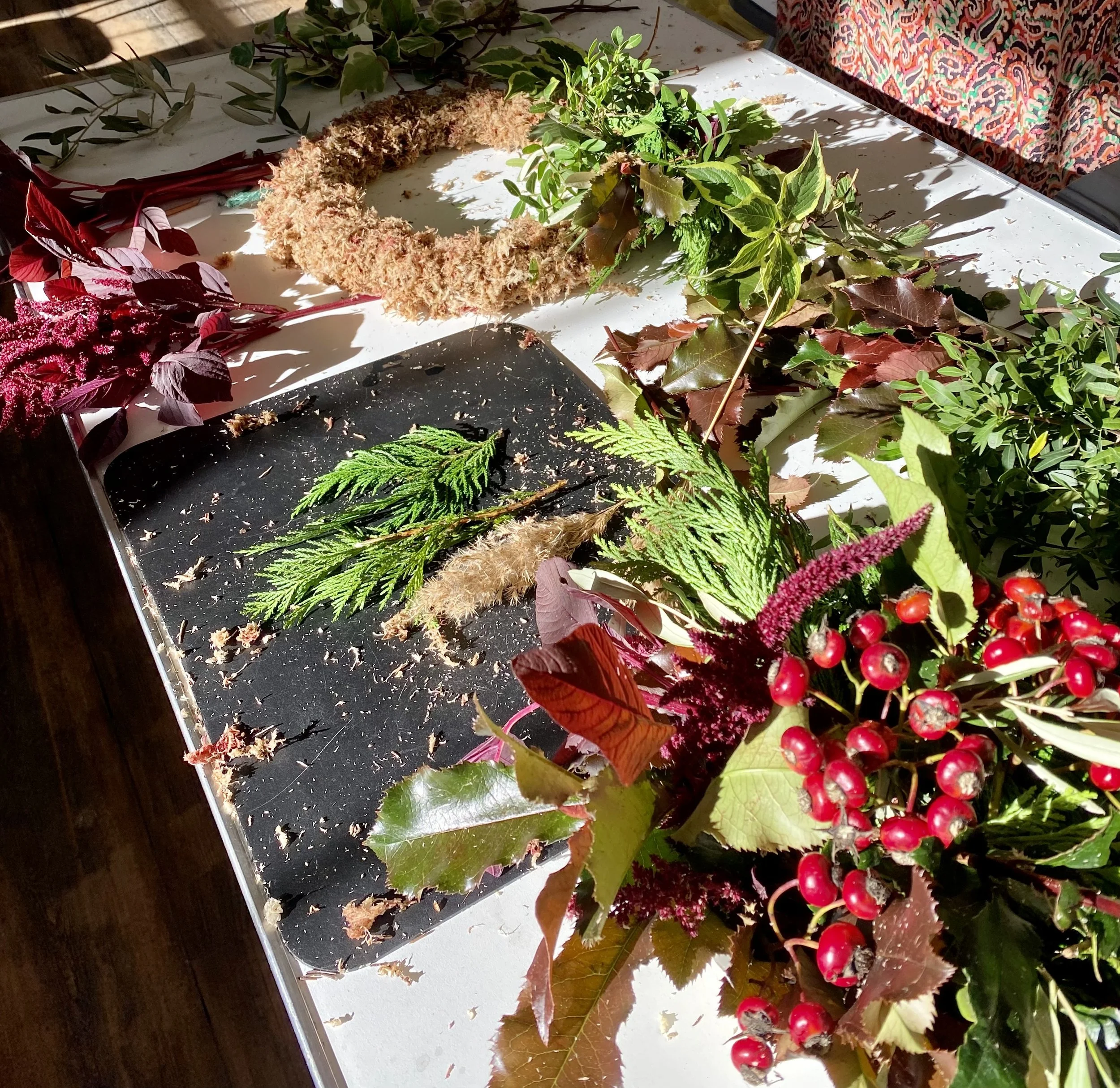 Autumn Wreath Workshops using seasonal foliage in autumnal colours with dried elements and fresh berries.