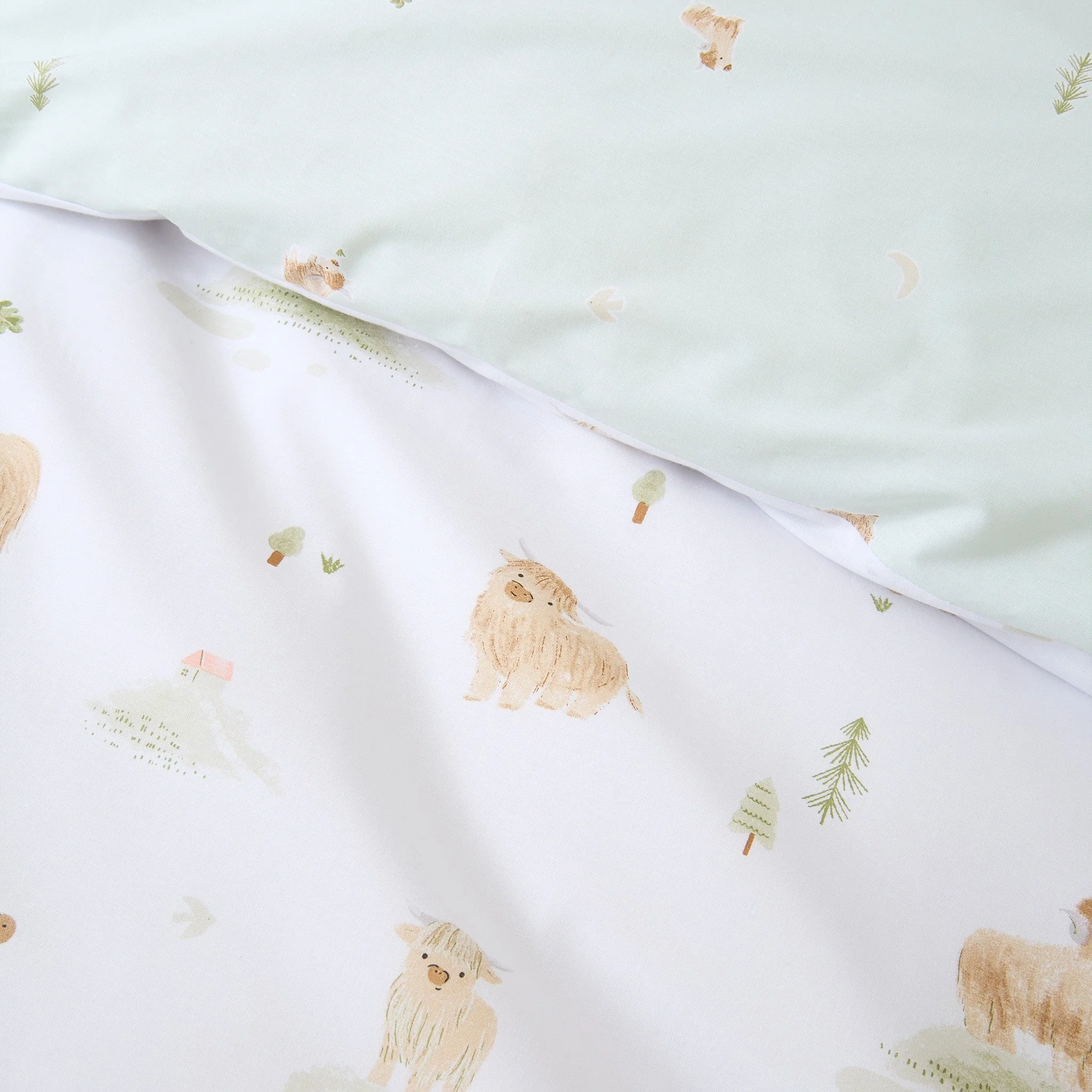 Bring a touch of the Highlands to your home 
Our Highland Cow bedlinen features adorable cows grazing across green pastures, with a reversible mini moo pattern for two charming looks in one. Crafted from beautifully soft, breathable cotton for a rest
