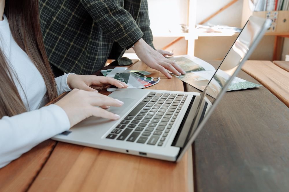 Laptop on a desk showing a website, used to review a commercial real estate website design