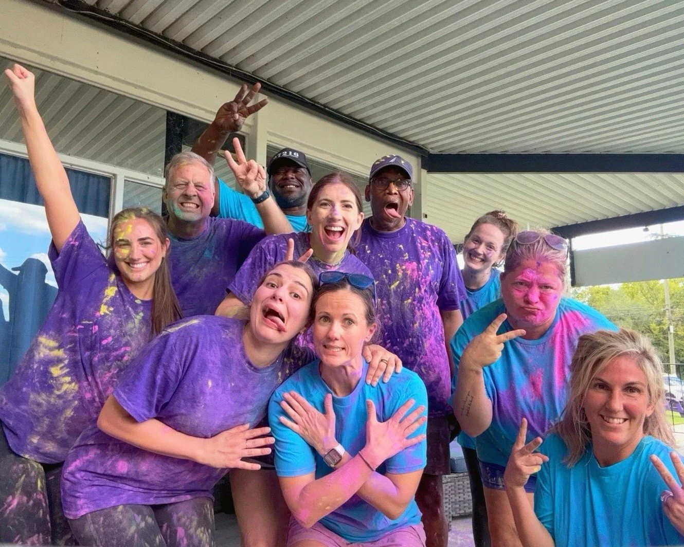 We took our staff value “No Islands” to heart this Friday by teaming up for some competition and much needed bonding time. 
Split into Team Blue and Team Purple, we faced off in three intense (and very colorful!) rounds of Capture the Fl