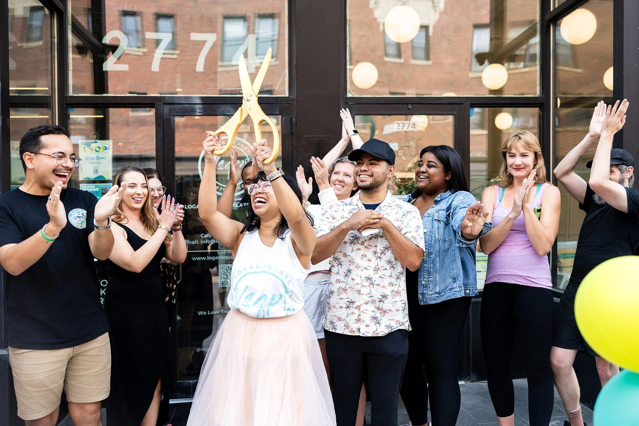 Ribbon cutting event in Chicago with excited participants