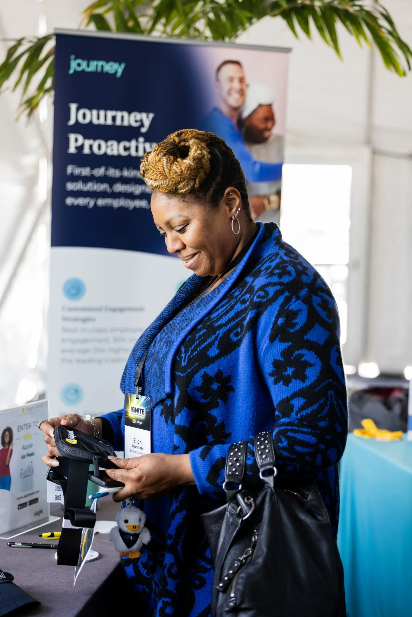Woman looking at vendor swag at a corporate event