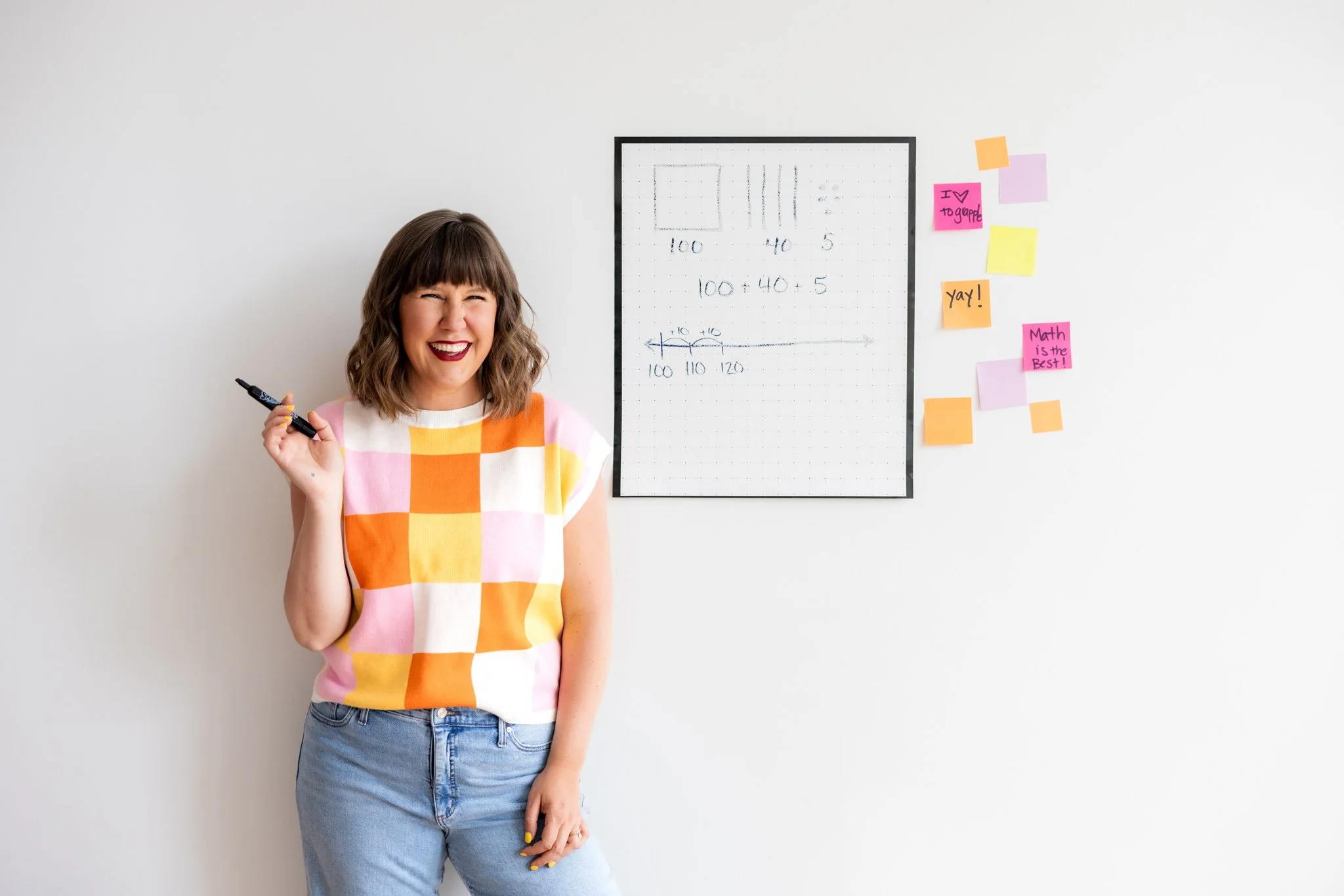 Personable headshot of a social media influencer in a colorful shirt