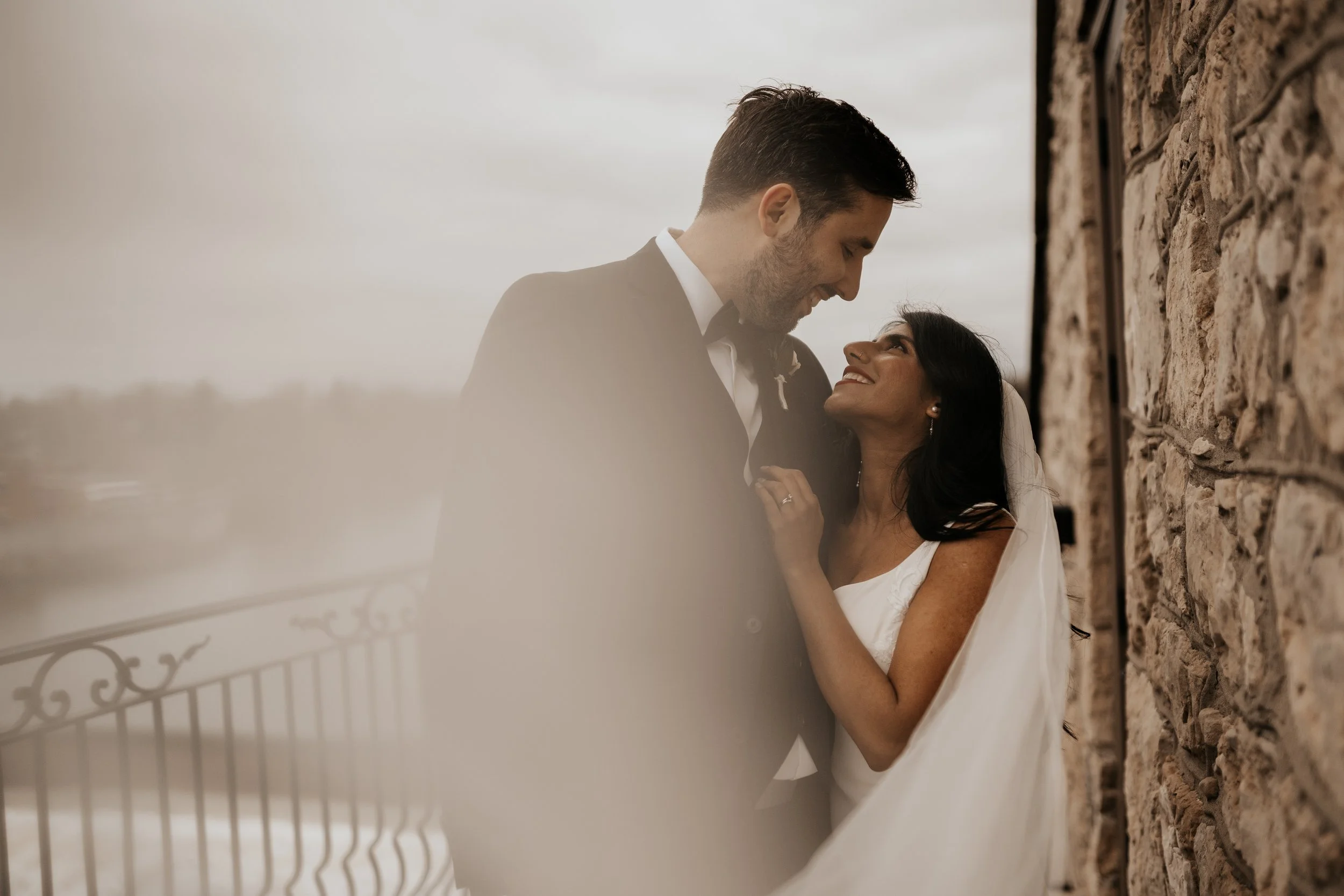 bride and groom embrace and lovingly look at eachother with inTUNE Wedding DJs
