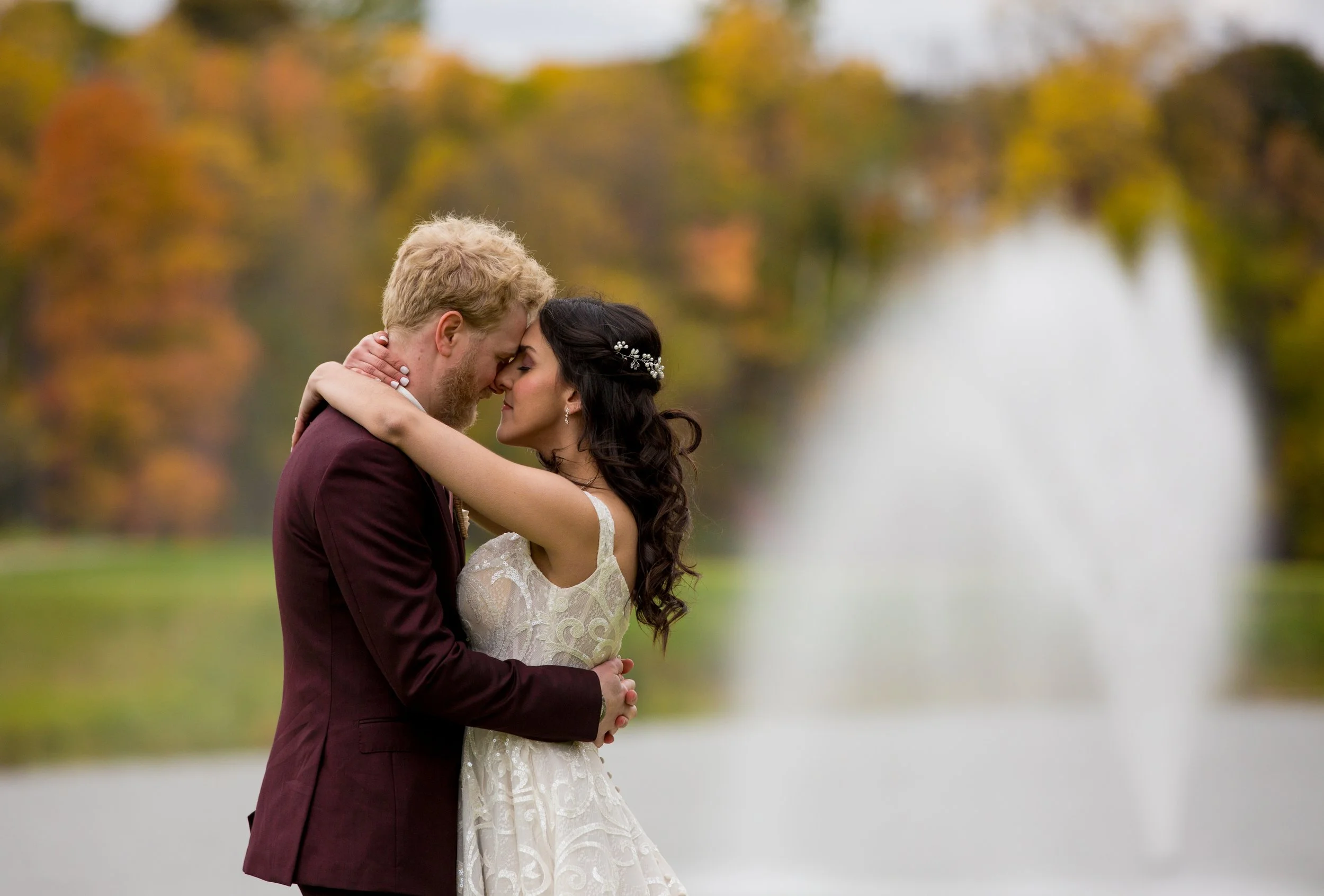 couple embracing outdoors at cambridge wedding venue galt country club